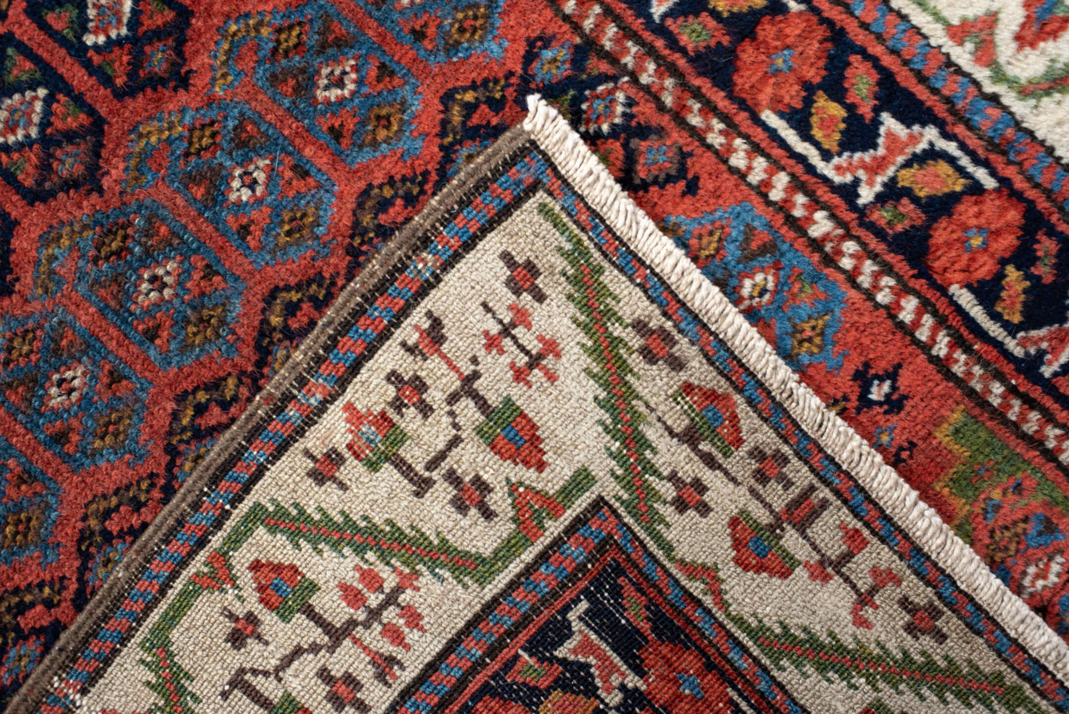 2' x 12' one-of-a-kind handmade vintage NW Persian runner rug. Color palette: black, blue, brown, gray, pink, red, redwood