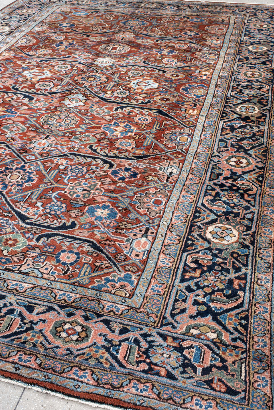 9' x 12' one-of-a-kind handmade antique Heriz large size rug. Color palette: rust, navy, ivory, sky_blue, camel, slate