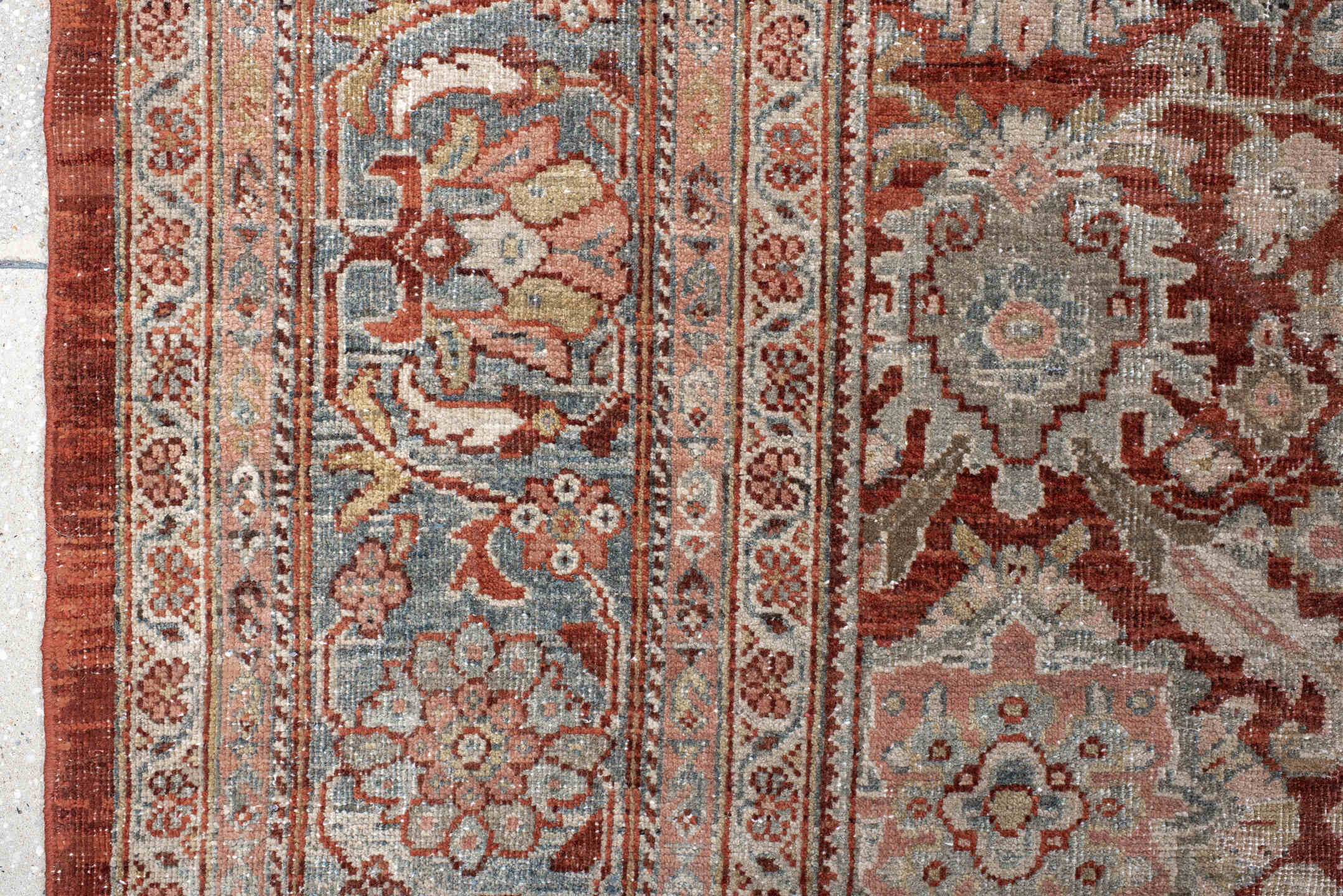 10' x 18' one-of-a-kind handmade antique Sultanabad rug. Color palette: rust, ivory, light blue, taupe, camel, brown