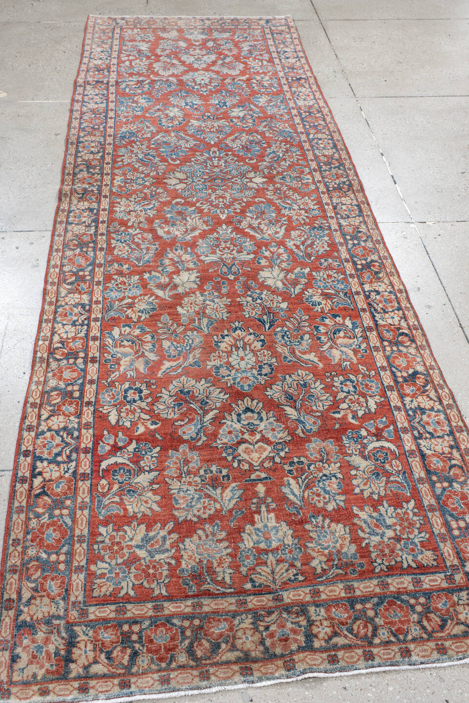3' x 11' one-of-a-kind handmade antique Sarouk runner rug. Color palette: rust, ivory, blue, navy, cream, terra cotta