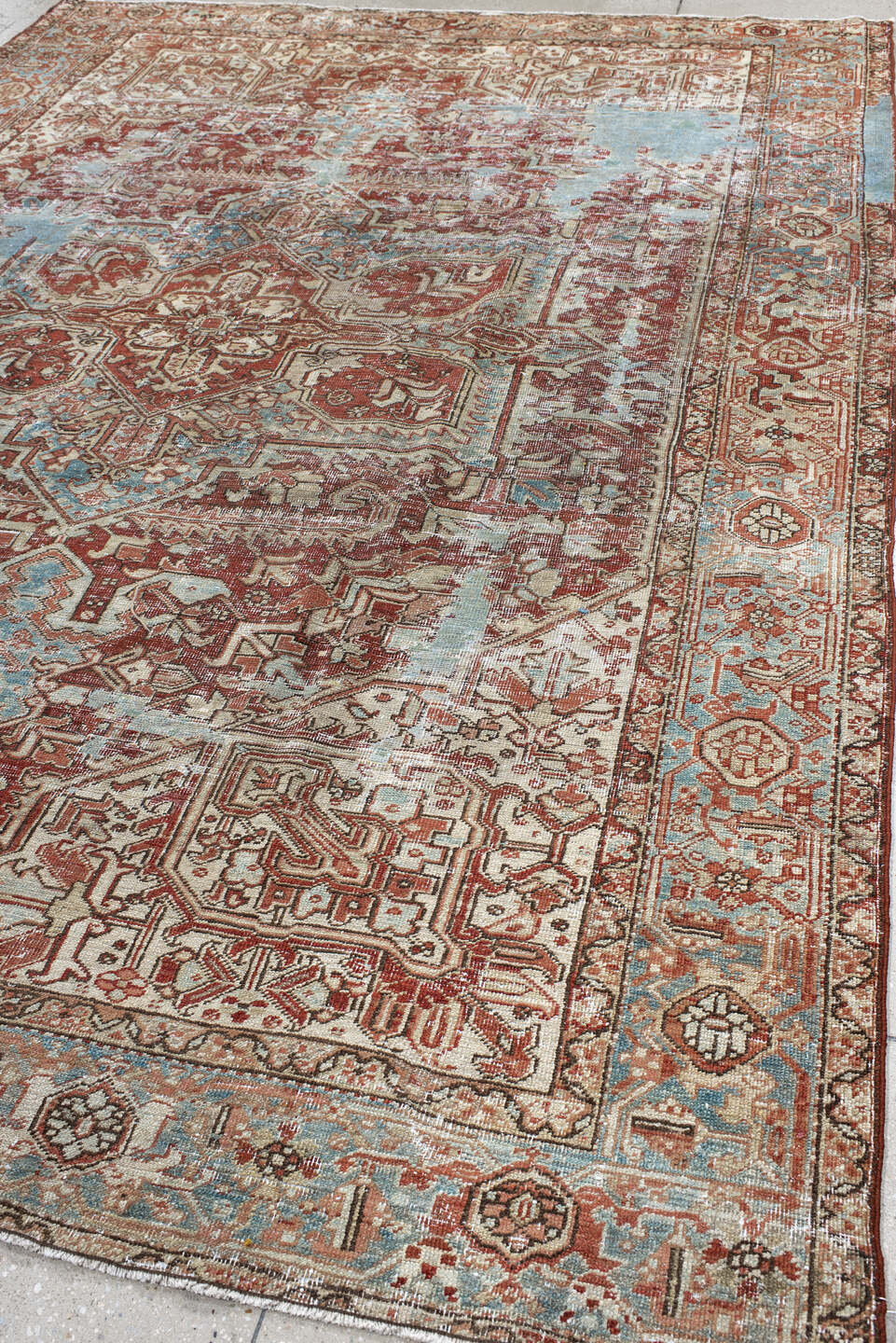 7' x 11' one-of-a-kind handmade antique Heriz large size rug. Color palette: ivory, rust, sky_blue, terra_cotta, taupe