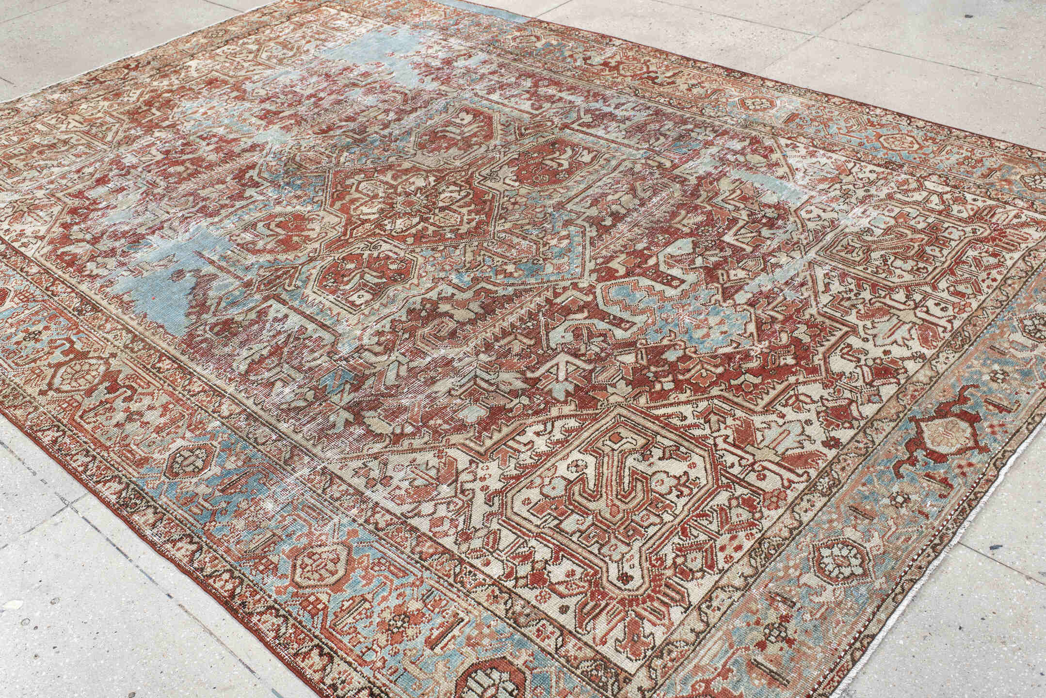 7' x 11' one-of-a-kind handmade antique Heriz large size rug. Color palette: ivory, rust, sky_blue, terra_cotta, taupe