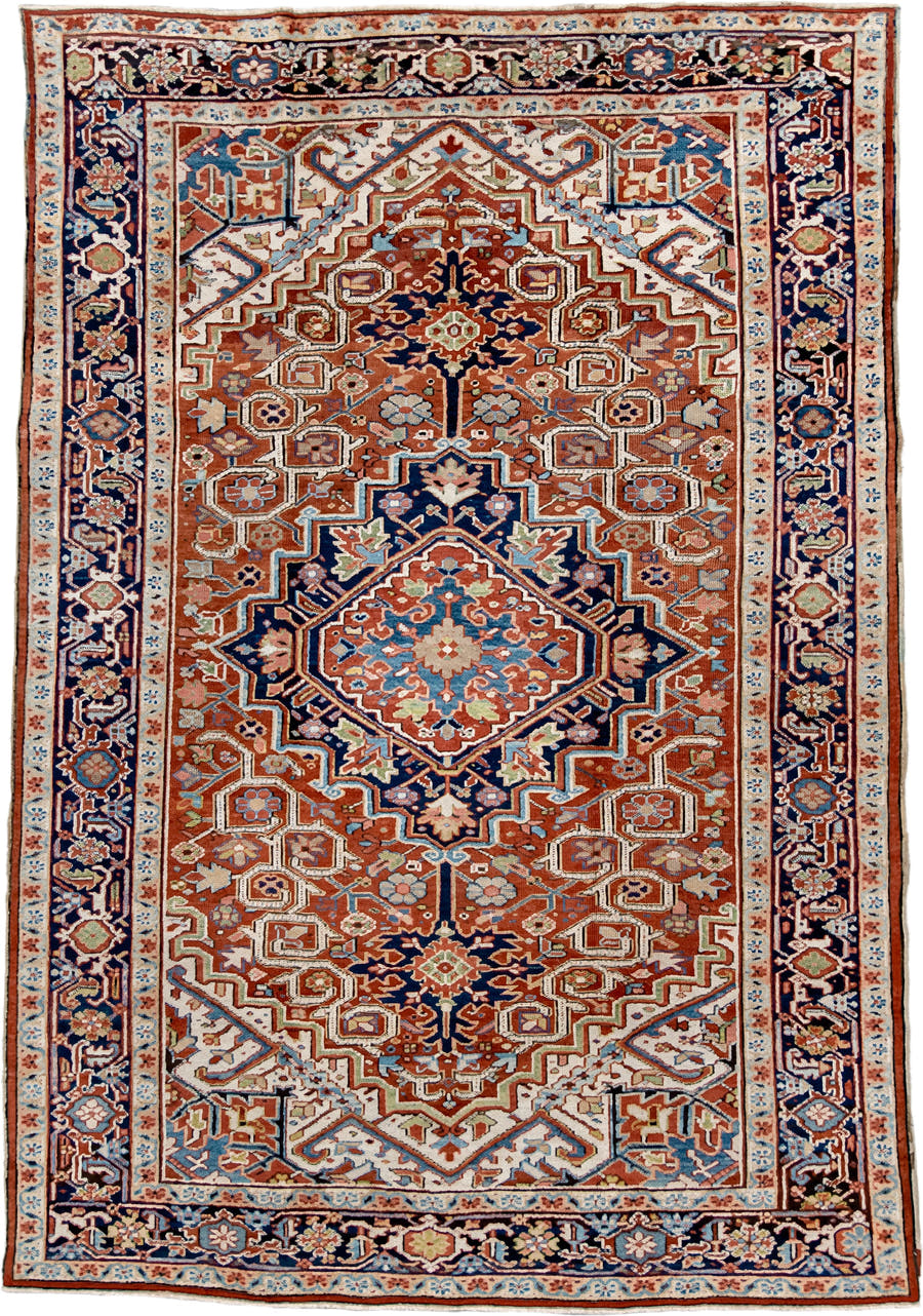7' x 11' one-of-a-kind handmade antique Heriz large size rug. Color palette: rust, navy, ivory, sky blue, terra cotta, camel