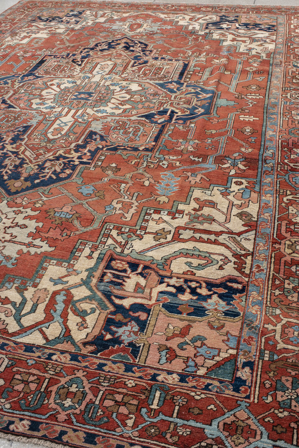 9' x 12' one-of-a-kind handmade vintage Serapi large size rug. Color palette: terra cotta, ivory, sky blue, navy, rust