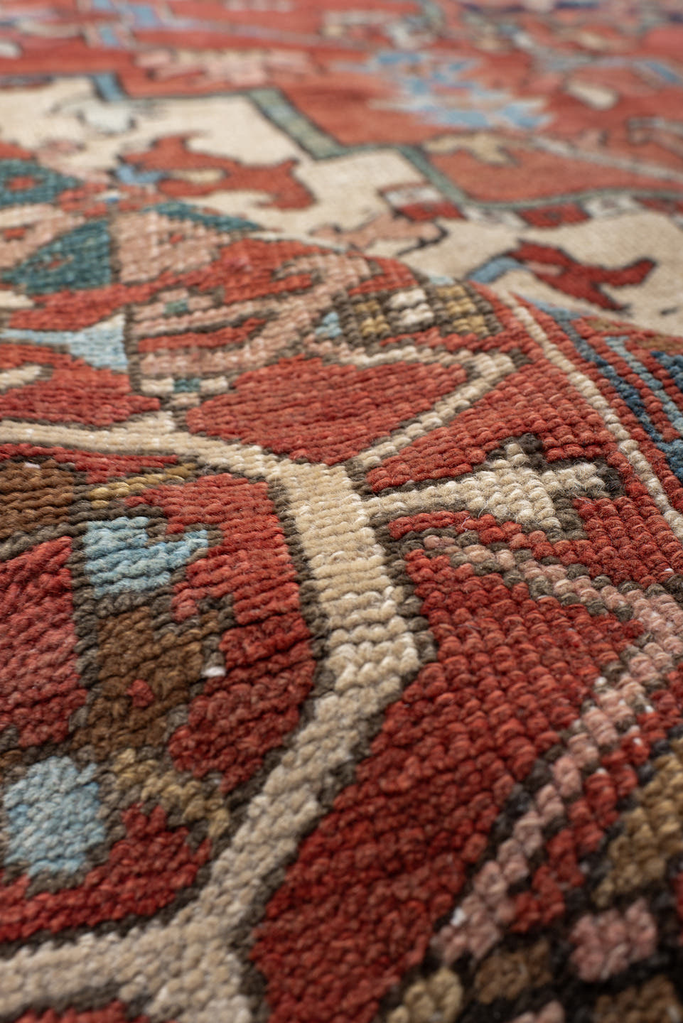 9' x 12' one-of-a-kind handmade vintage Serapi large size rug. Color palette: terra cotta, ivory, sky blue, navy, rust