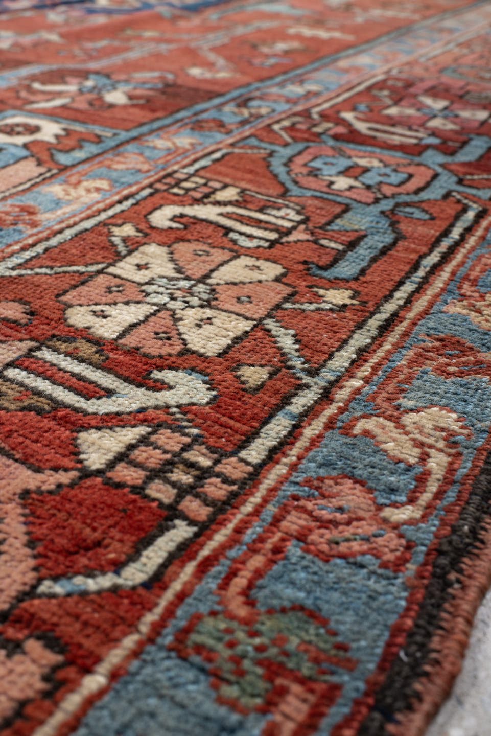 9' x 12' one-of-a-kind handmade vintage Serapi large size rug. Color palette: terra cotta, ivory, sky blue, navy, rust