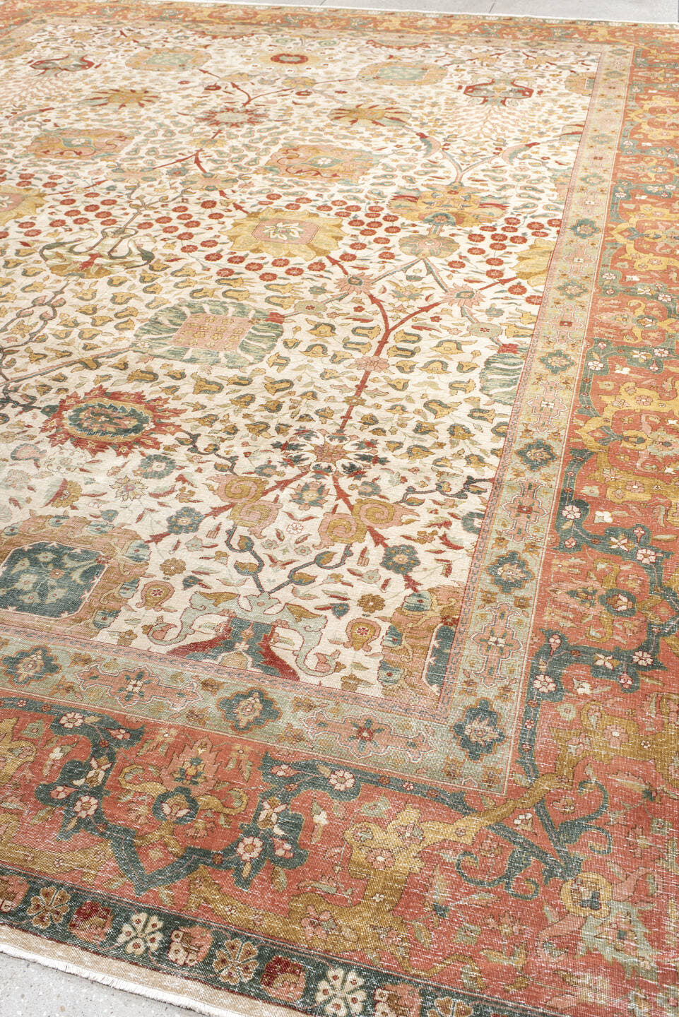 12' x 16' one-of-a-kind handmade antique Agra oversize rug. Color palette: ivory, coral, sage, rust, gold, taupe