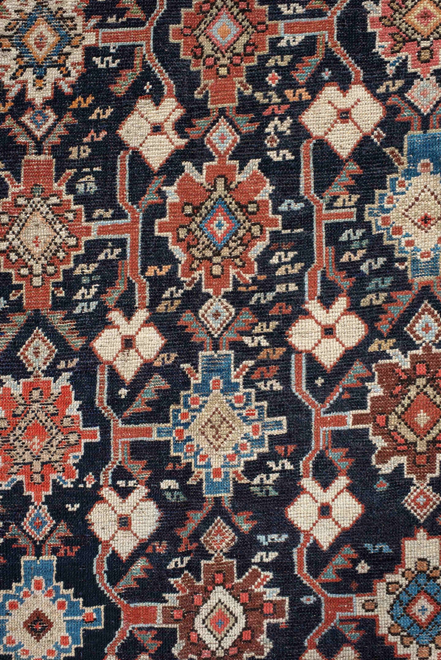 4' x 9' one-of-a-kind handmade antique Karabagh runner rug. Color palette: navy, terra cotta, ivory, light blue, rust, brown