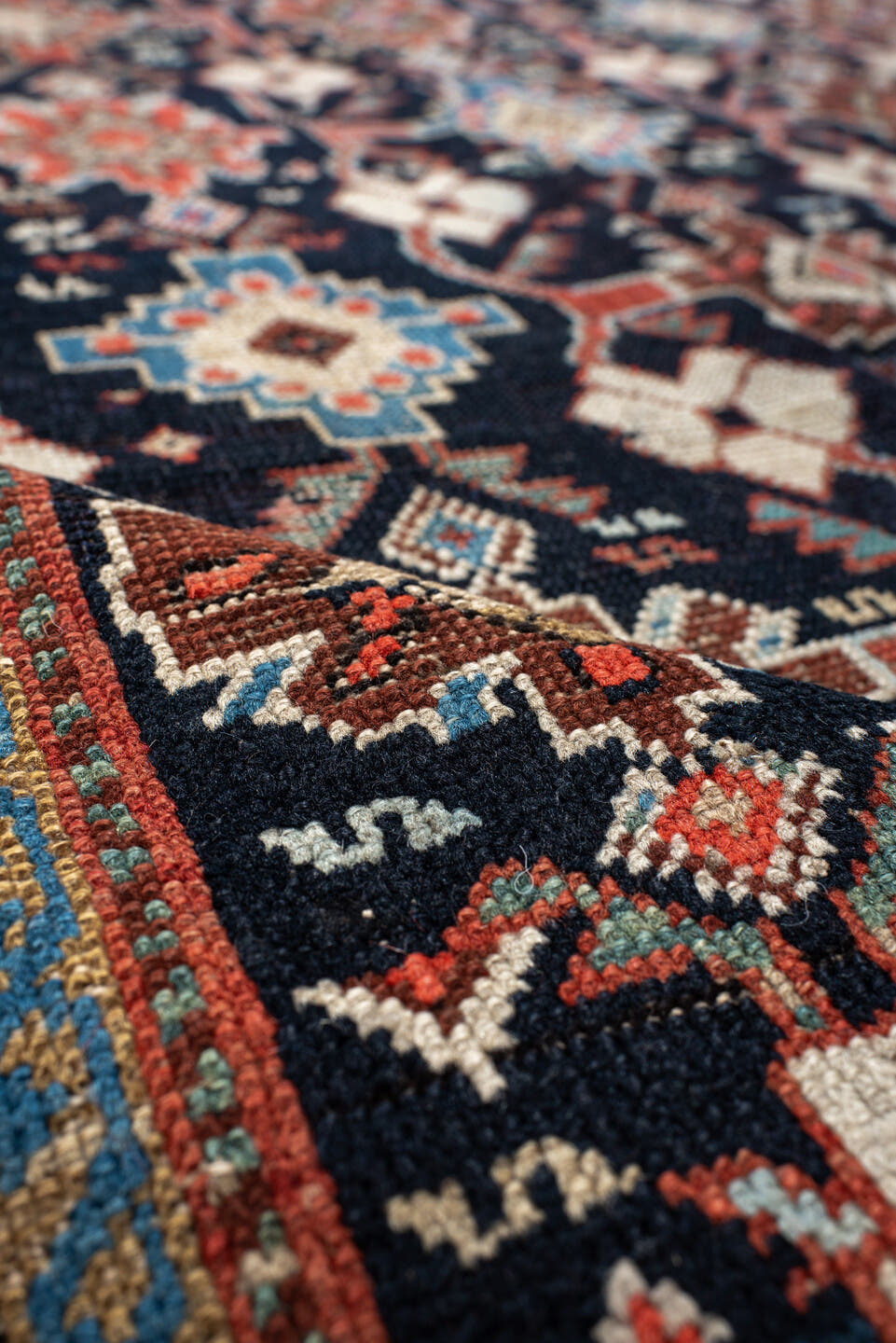 4' x 9' one-of-a-kind handmade antique Karabagh runner rug. Color palette: navy, terra cotta, ivory, light blue, rust, brown
