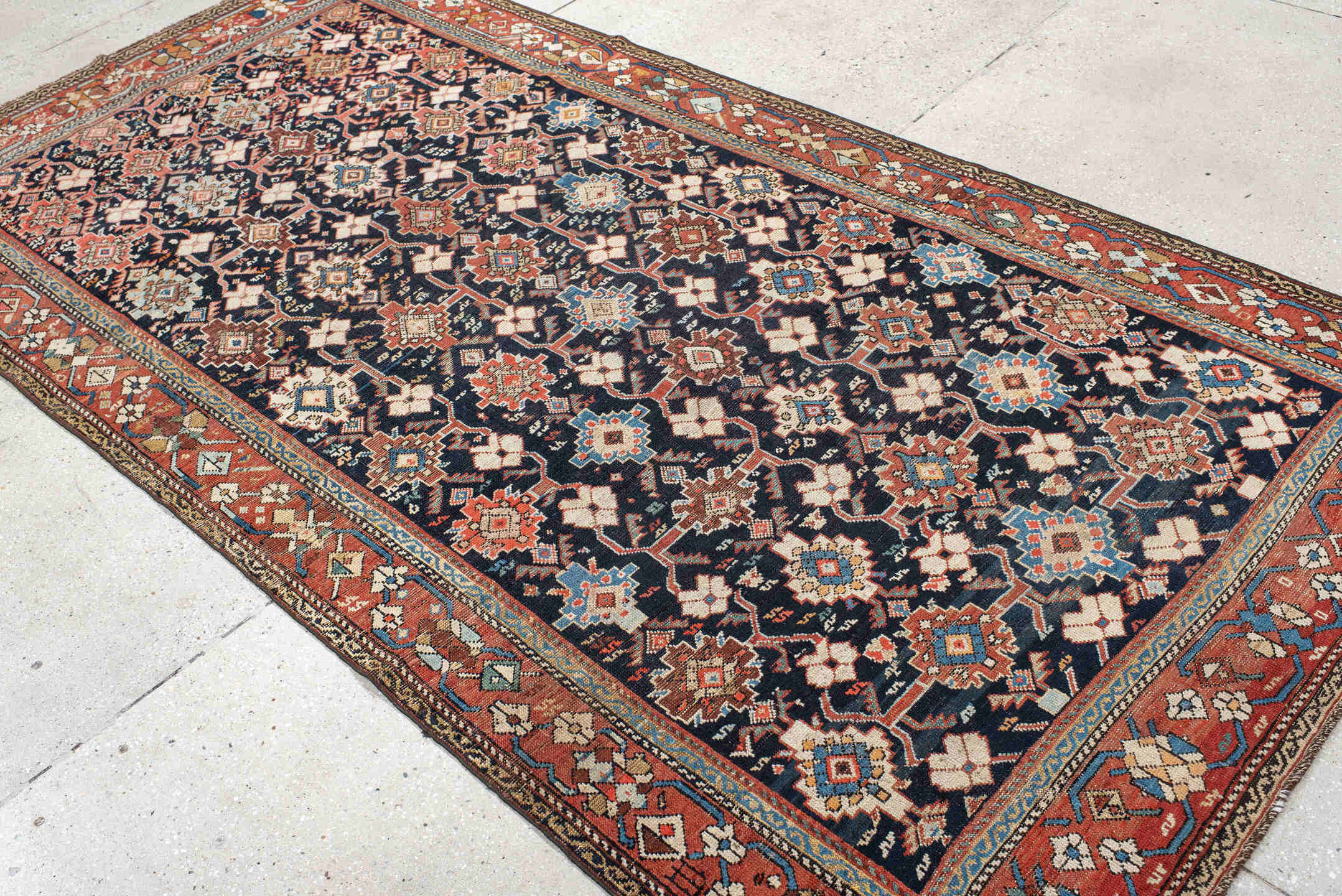 4' x 9' one-of-a-kind handmade antique Karabagh runner rug. Color palette: navy, terra cotta, ivory, light blue, rust, brown