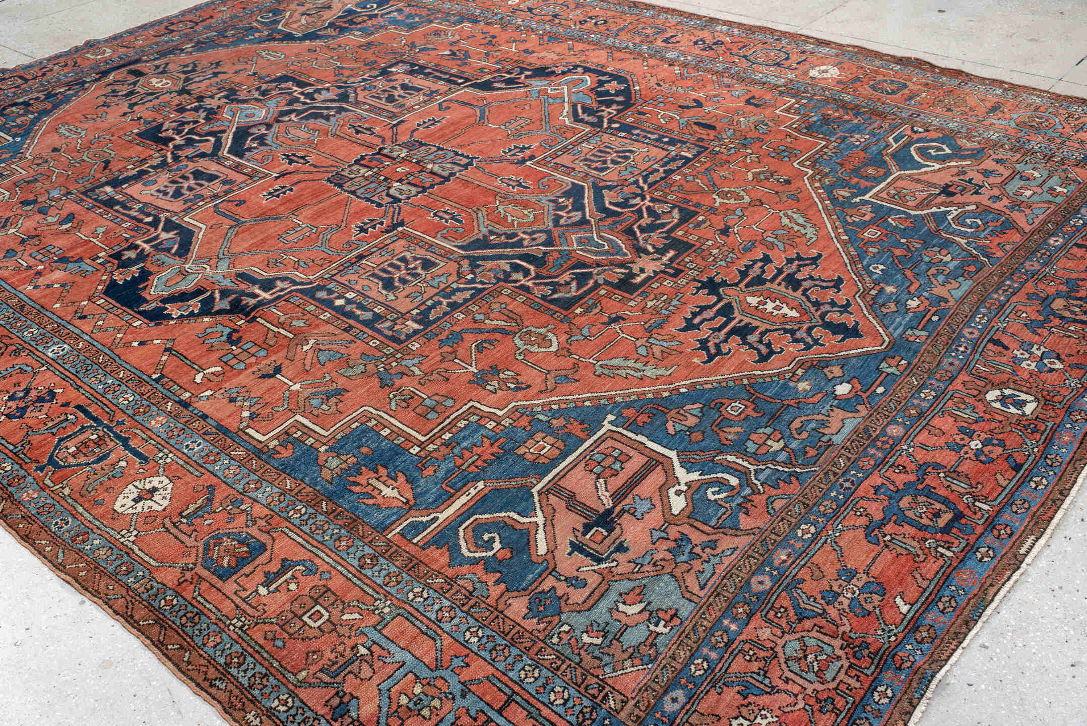 10' x 13' one-of-a-kind handmade antique Serapi large size rug. Color palette: terra cotta, navy, ivory, rust, sky blue