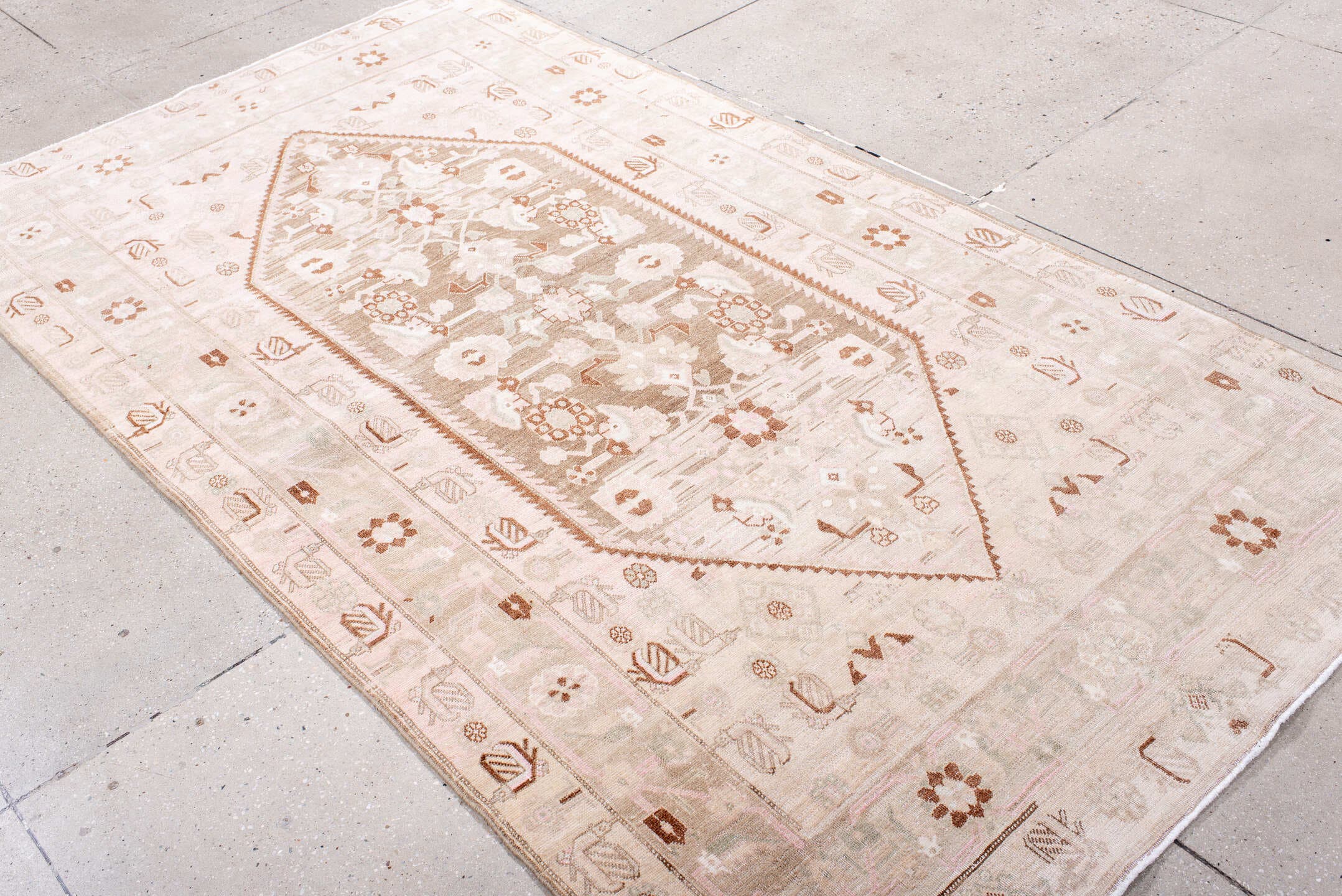 4' x 8' one-of-a-kind handmade antique Bidjar rug. Color palette: ivory, blush, taupe, camel, brown, rose, pink, beige, gray