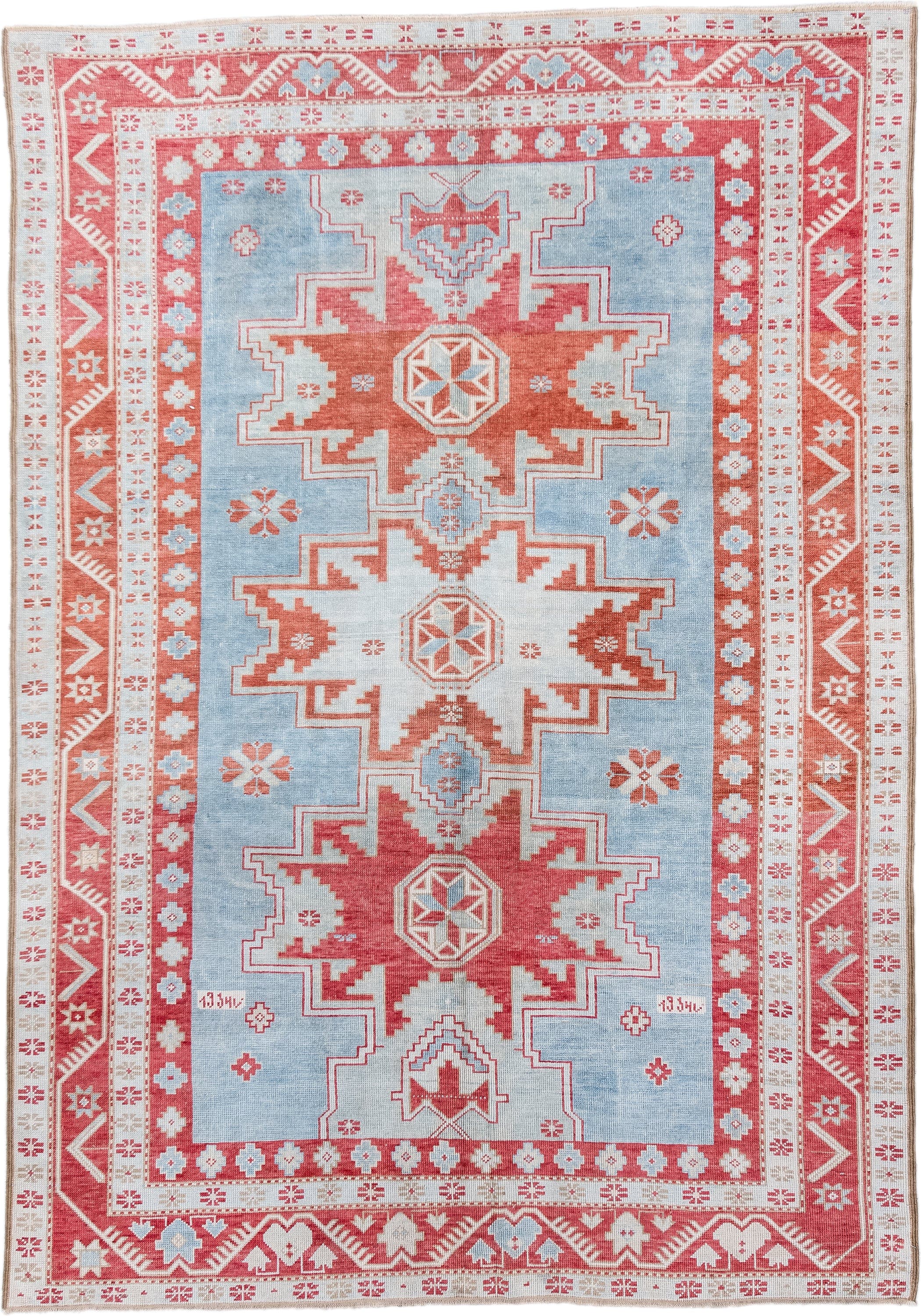 5' x 7' one-of-a-kind handmade antique Caucasian rug. Color palette: sky blue, coral, ivory, brick red, pale blue