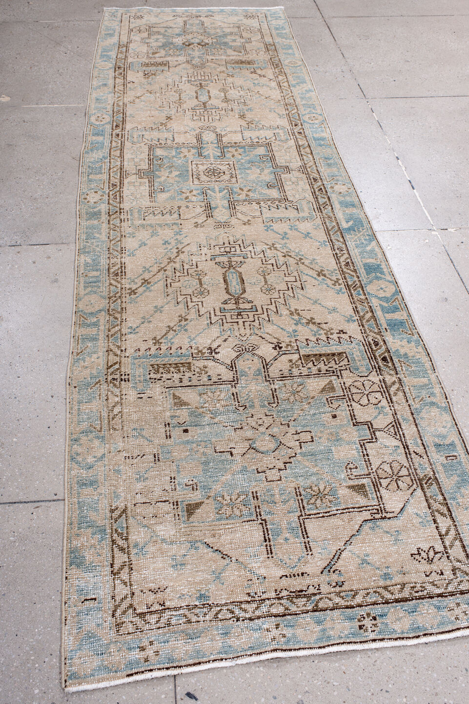 3' x 11' one-of-a-kind handmade antique Heriz runner rug. Color palette: ivory, sky blue, taupe, brown, camel, light blue