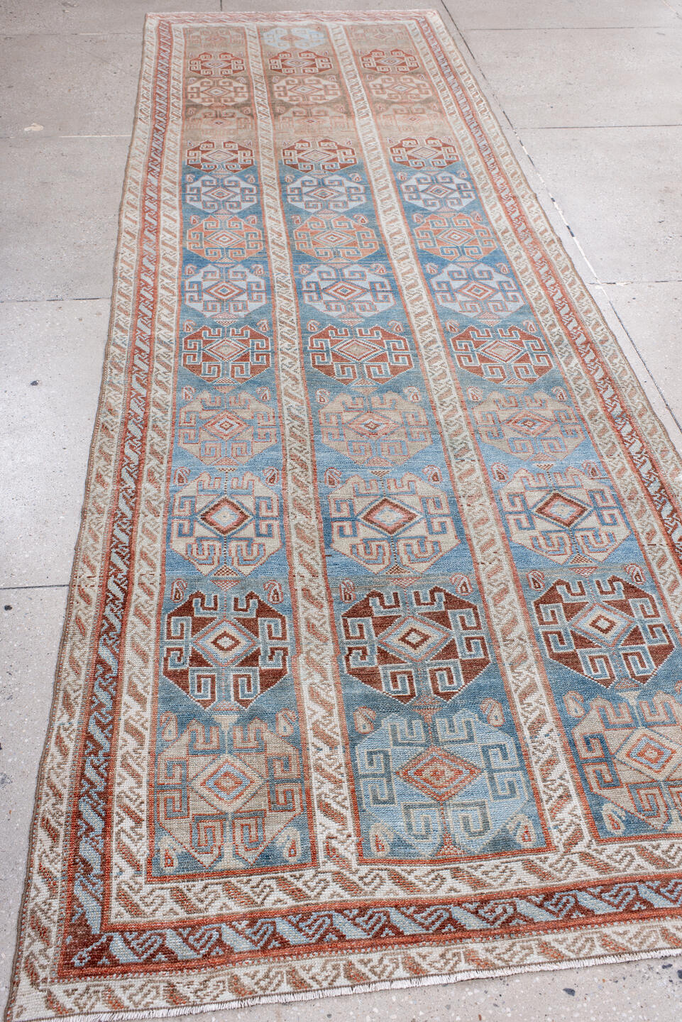 4' x 12' one-of-a-kind handmade antique NW Persian runner rug. Color palette: sky blue, ivory, terracotta, rust, camel