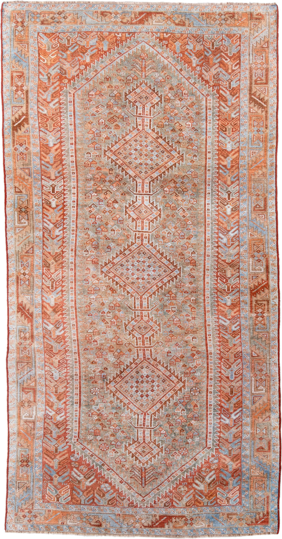 4' x 8' one-of-a-kind handmade antique Shiraz rug. Color palette: rust, ivory, pale blue, terra cotta, camel, taupe, brown