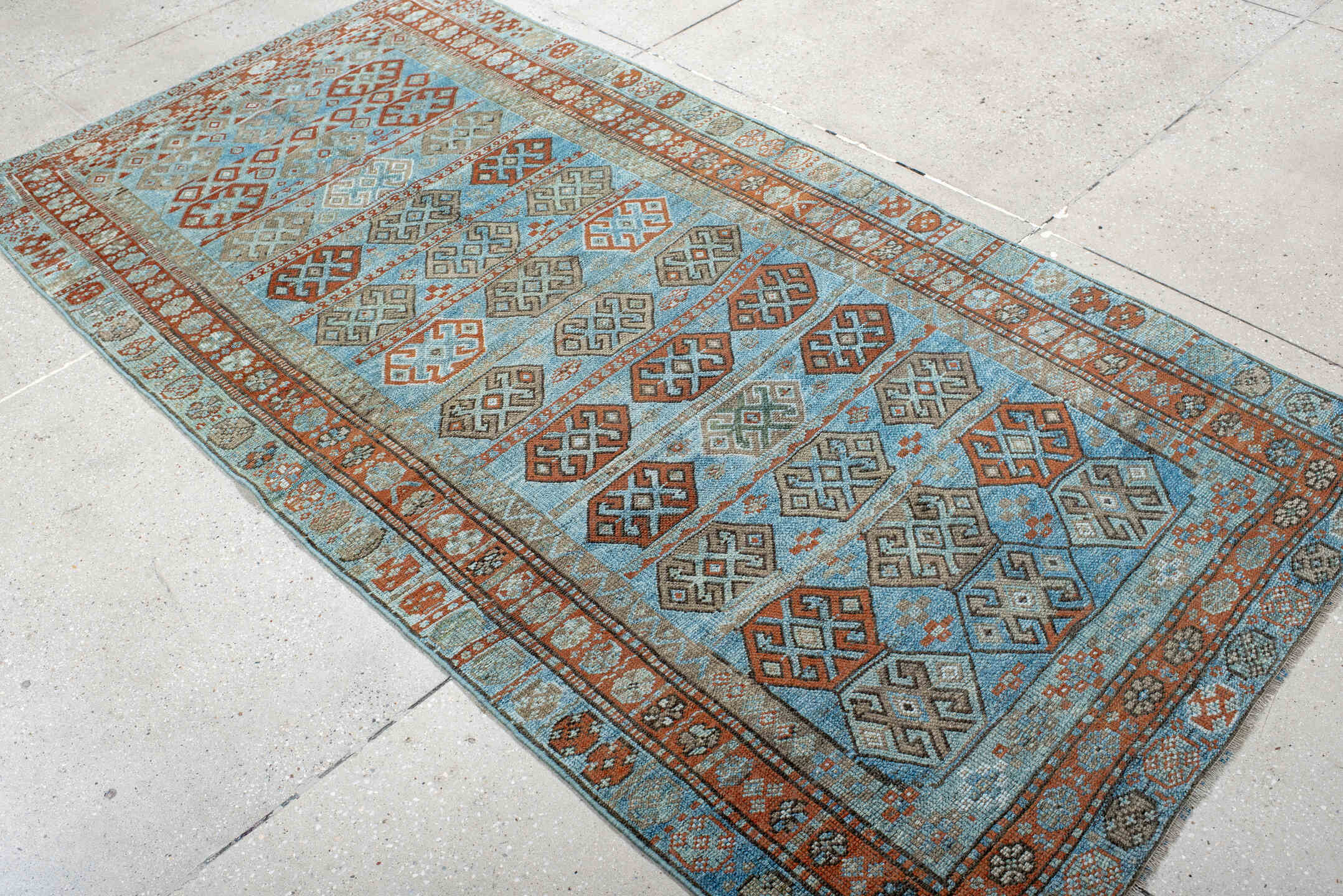 4' x 8' one-of-a-kind handmade antique Kurd runner rug. Color palette: sky blue, rust, taupe, ivory, slate, camel