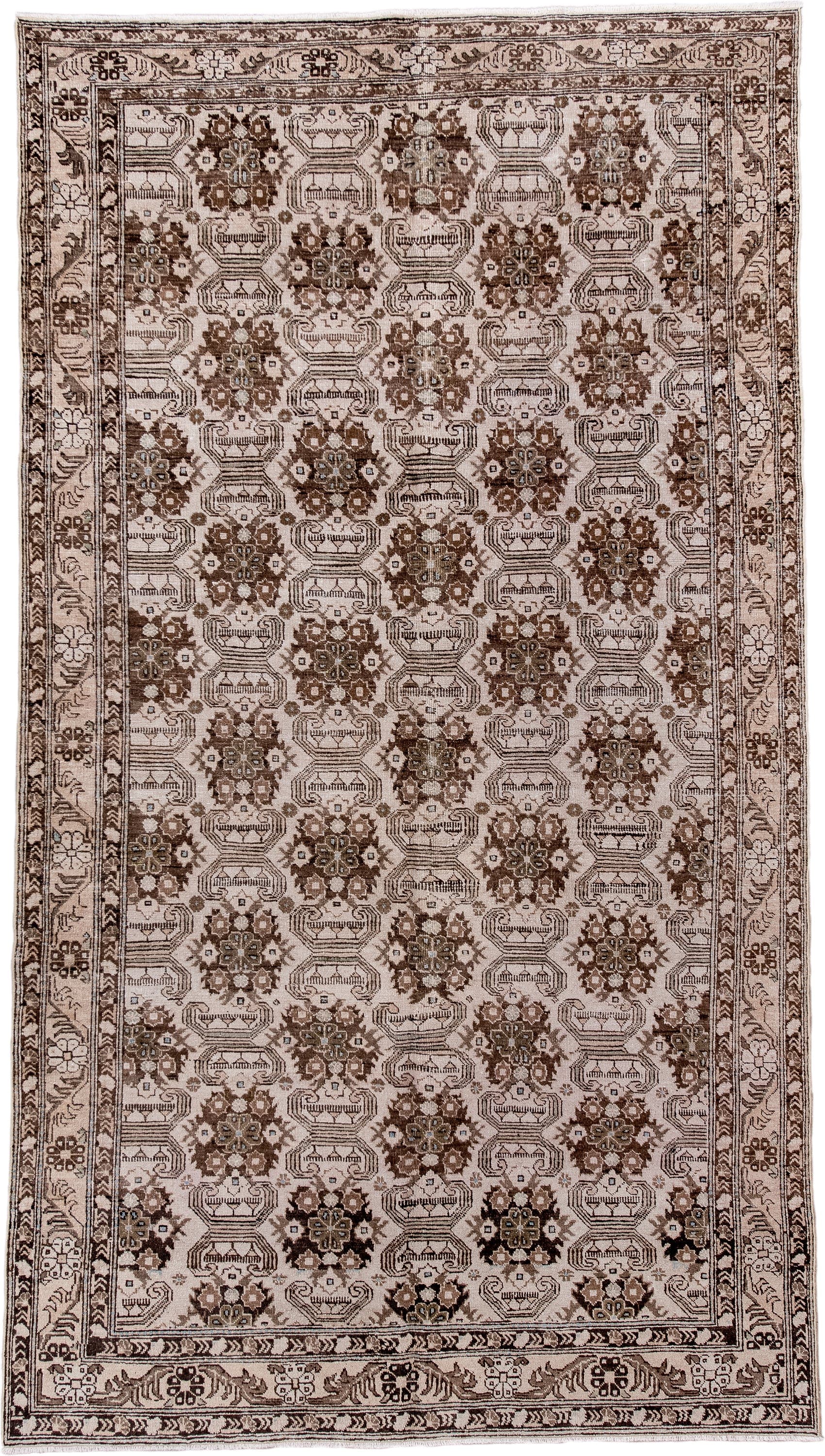 5' x 9' one-of-a-kind handmade antique Tabriz medium size rug. Color palette: ivory, brown, taupe, camel, charcoal, beige