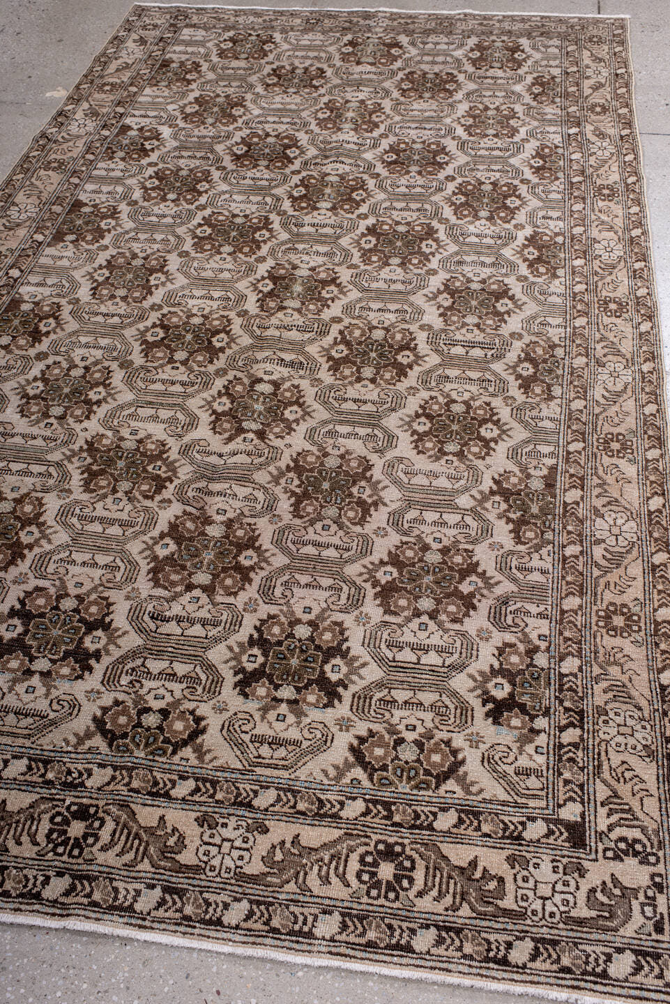 5' x 9' one-of-a-kind handmade antique Tabriz medium size rug. Color palette: ivory, brown, taupe, camel, charcoal, beige