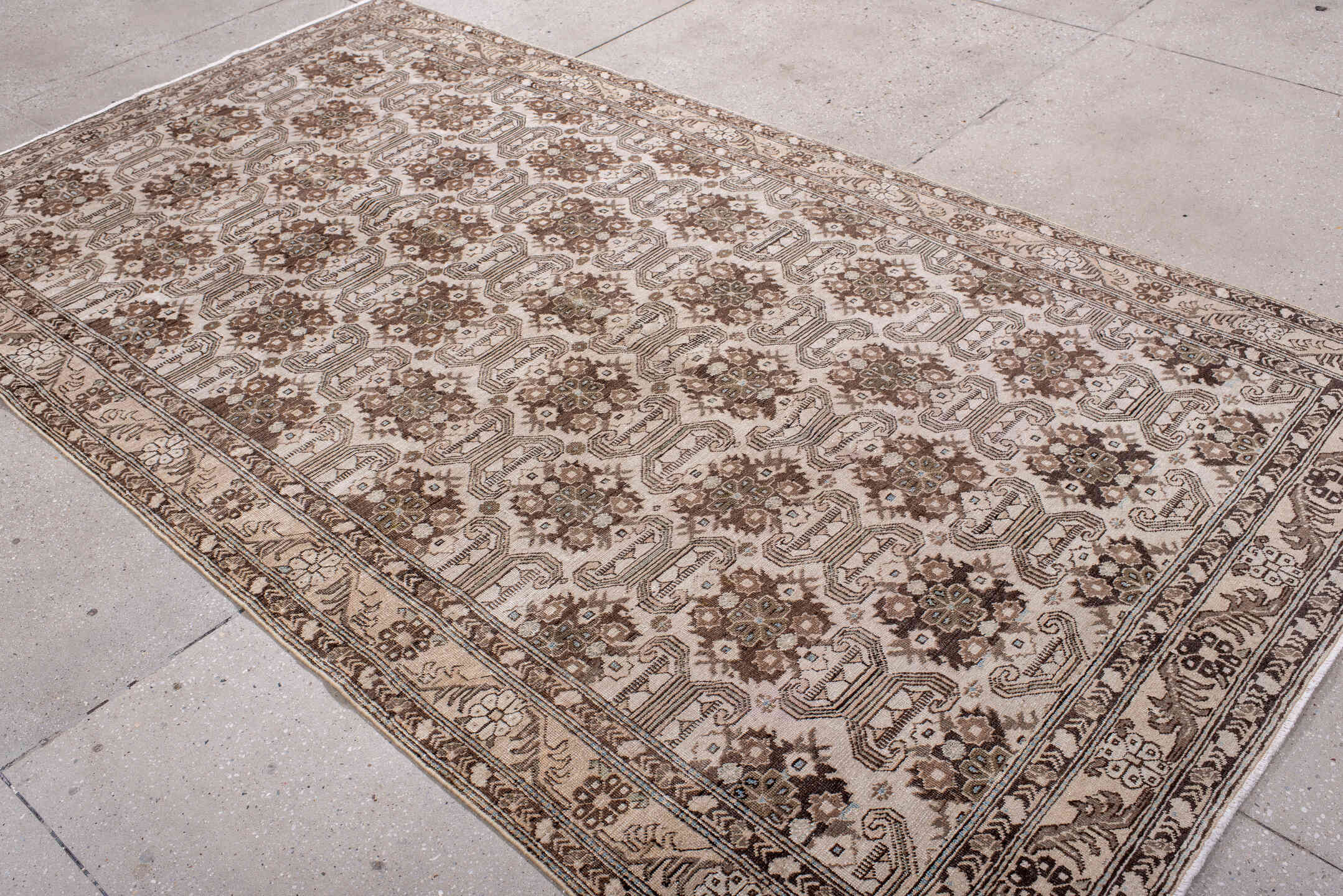 5' x 9' one-of-a-kind handmade antique Tabriz medium size rug. Color palette: ivory, brown, taupe, camel, charcoal, beige