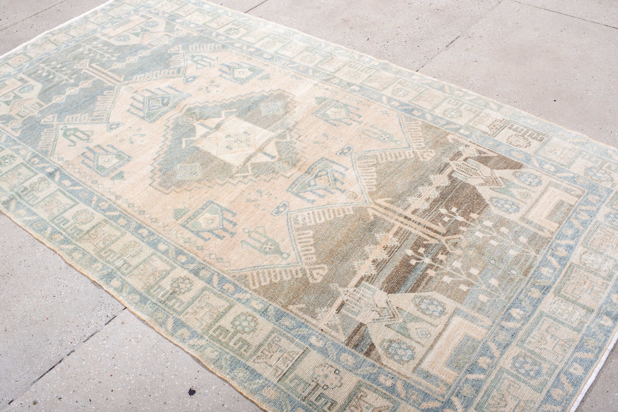 4' x 9' one-of-a-kind handmade antique Hamadan rug. Color palette: ivory, pale blue, blush, taupe, camel, sage, brown