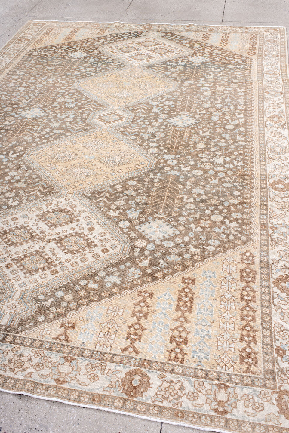 7' x 11' one-of-a-kind handmade antique  large size rug. Color palette: taupe, ivory, camel, pale_blue, tan, beige, gray