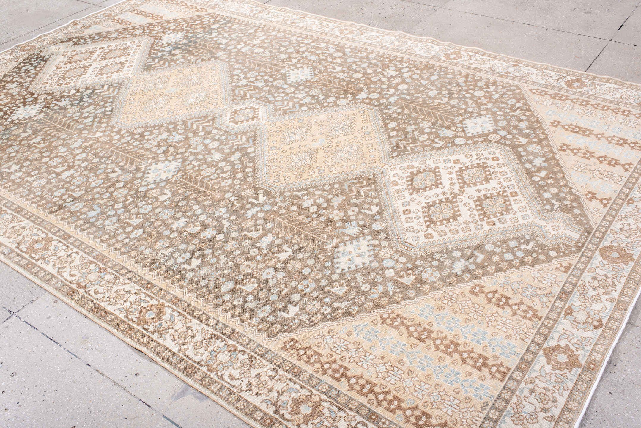 7' x 11' one-of-a-kind handmade antique  large size rug. Color palette: taupe, ivory, camel, pale_blue, tan, beige, gray