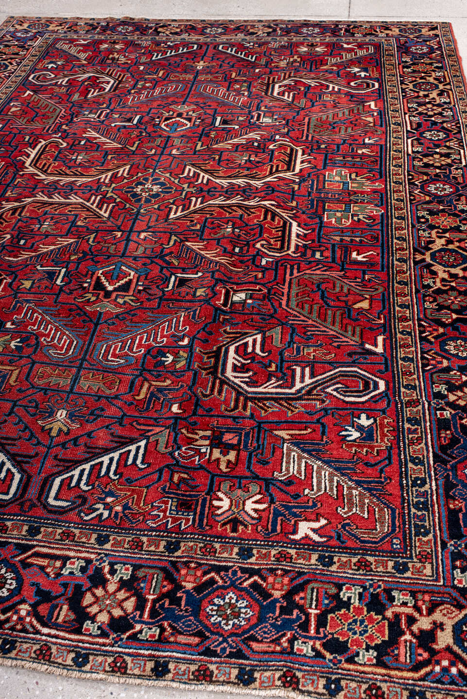 7' x 10' one-of-a-kind handmade antique Heriz large size rug. Color palette: red, navy, ivory, sky blue, camel, rust, brown