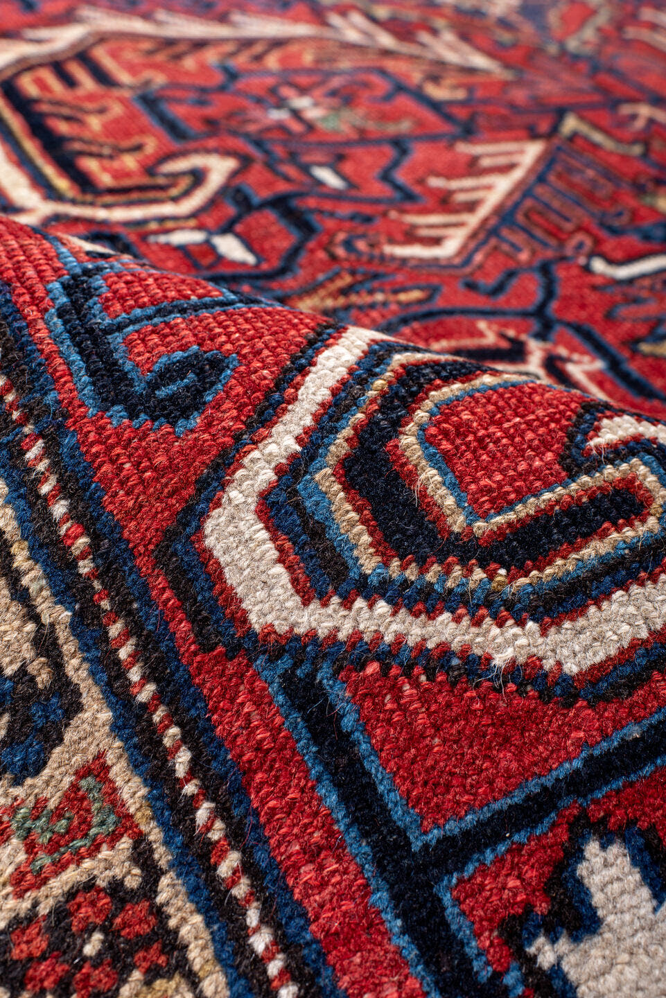 7' x 10' one-of-a-kind handmade antique Heriz large size rug. Color palette: red, navy, ivory, sky blue, camel, rust, brown