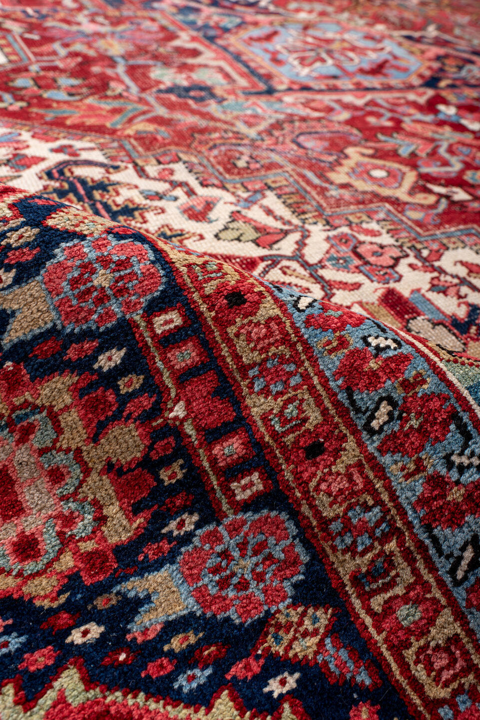 10' x 14' one-of-a-kind handmade antique Heriz large size rug. Color palette: rust, navy, ivory, sky_blue, crimson, coral