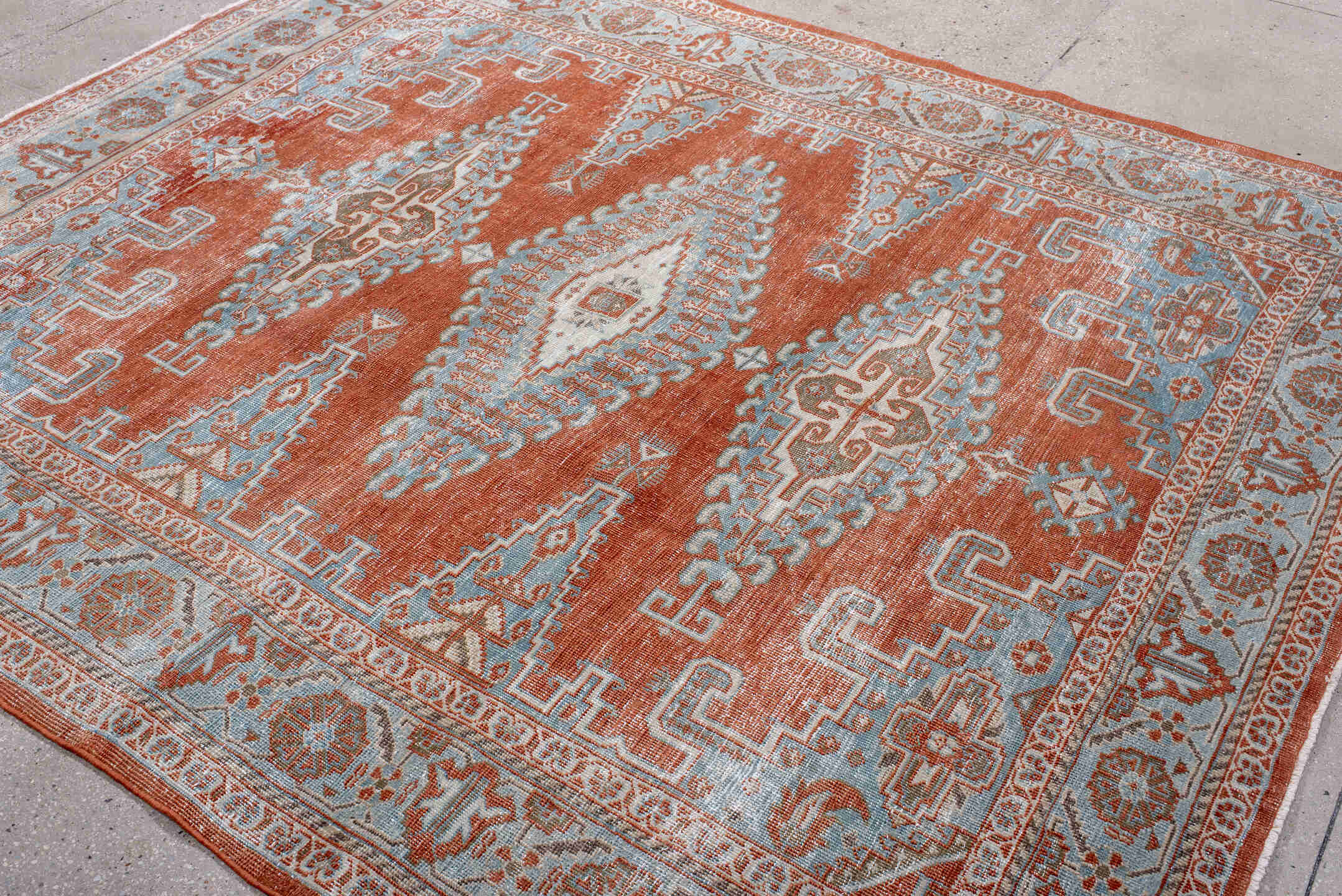 7' x 8' one-of-a-kind handmade antique Veece rug. Color palette: rust, pale blue, ivory, taupe, camel, terracotta, brown