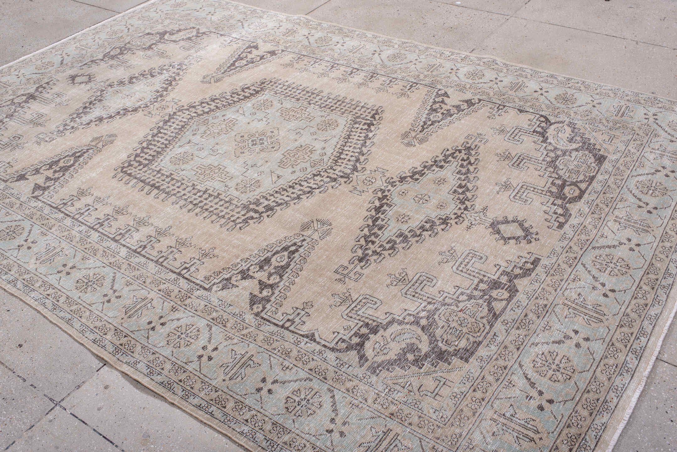 7' x 10' one-of-a-kind handmade antique Veece large size rug. Color palette: ivory, taupe, charcoal, brown, beige, gray