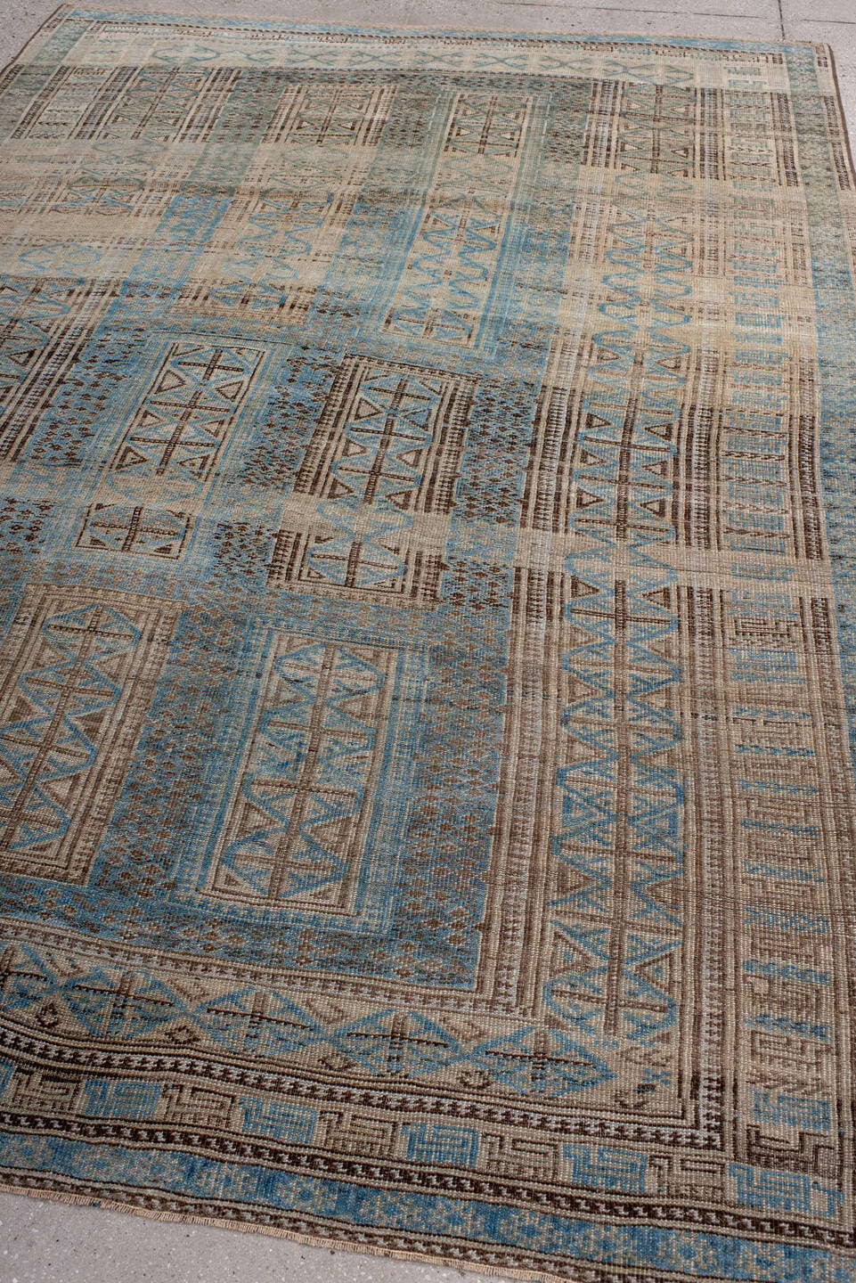6' x 9' one-of-a-kind handmade antique Belouch medium size rug. Color palette: ivory, sky blue, brown, charcoal, taupe