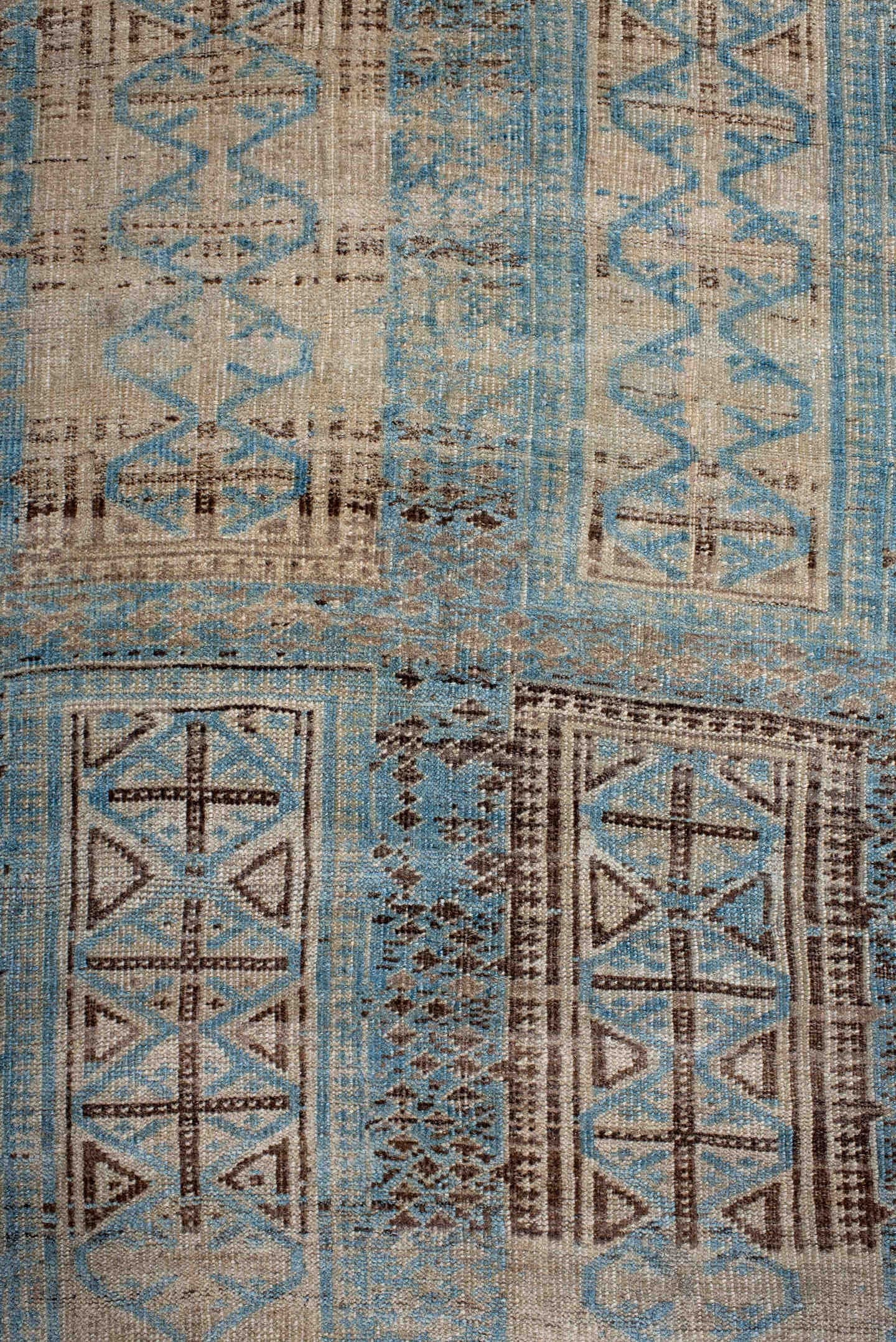 6' x 9' one-of-a-kind handmade antique Belouch medium size rug. Color palette: ivory, sky blue, brown, charcoal, taupe