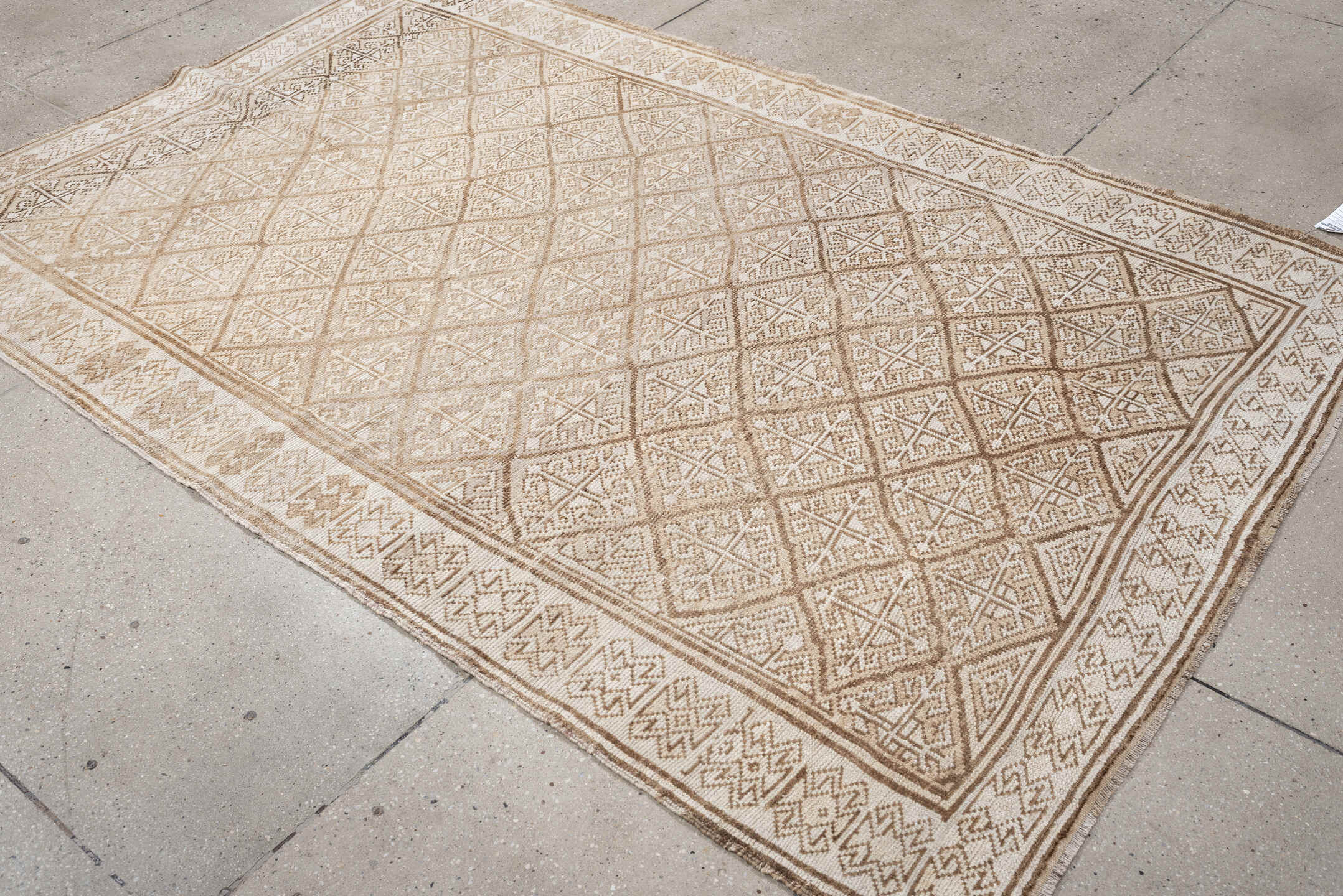 5' x 7' one-of-a-kind handmade antique medium size rug. Color palette: ivory, camel, taupe, beige, sand, gray