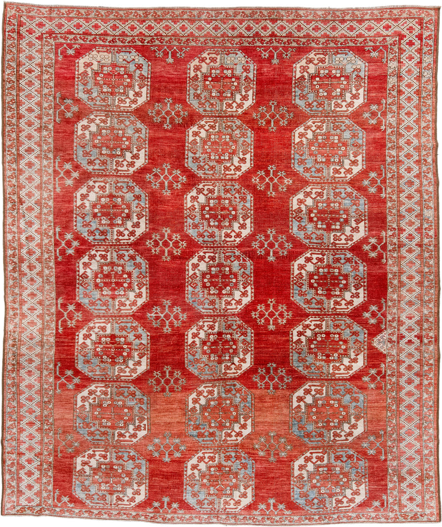 7' x 9' one-of-a-kind handmade antique Afghan rug. Color palette: red, ivory, rust, sky_blue, salmon, terracotta, brown