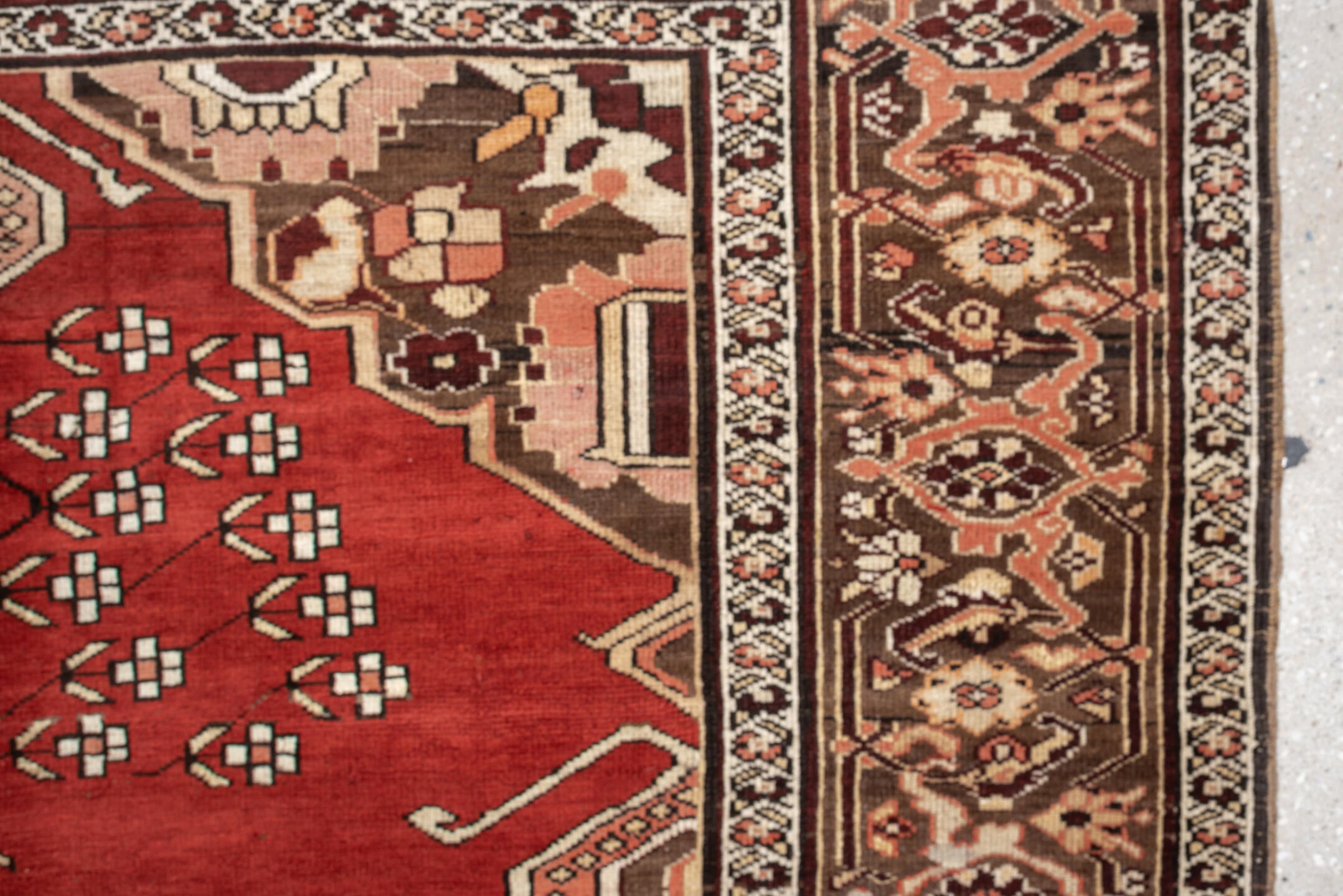 5' x 6' one-of-a-kind handmade antique Caucasian rug. Color palette: terracotta, ivory, taupe, brown, rose, mahogany, camel