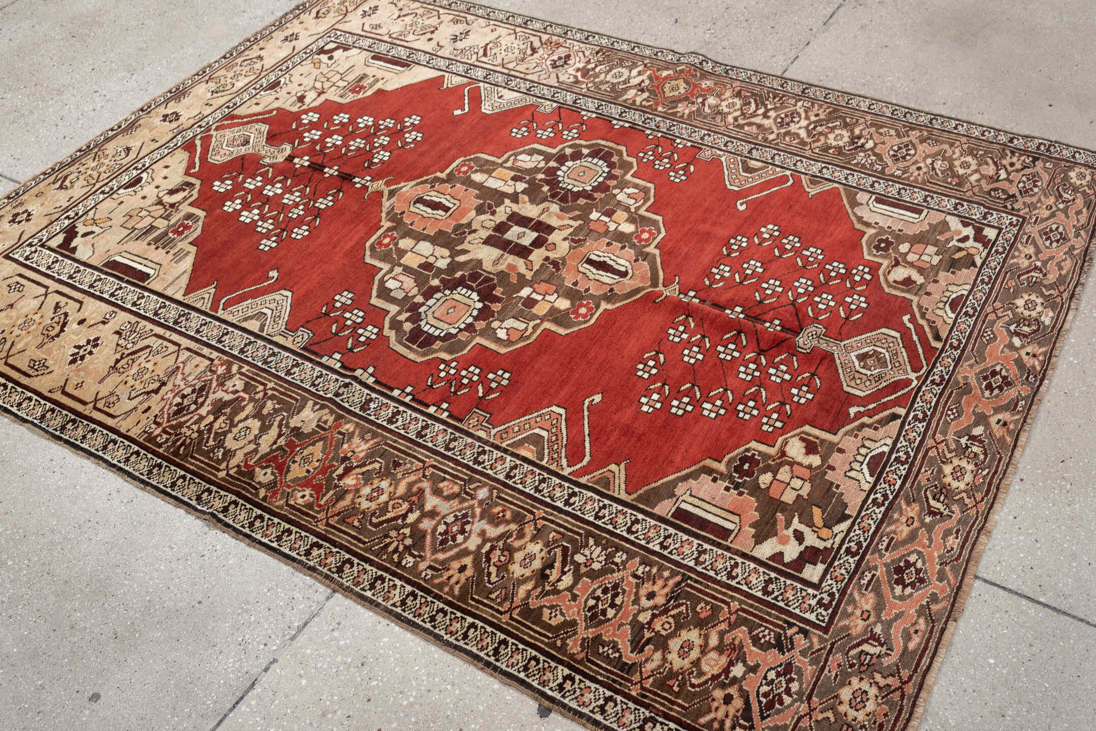 5' x 6' one-of-a-kind handmade antique Caucasian rug. Color palette: terracotta, ivory, taupe, brown, rose, mahogany, camel