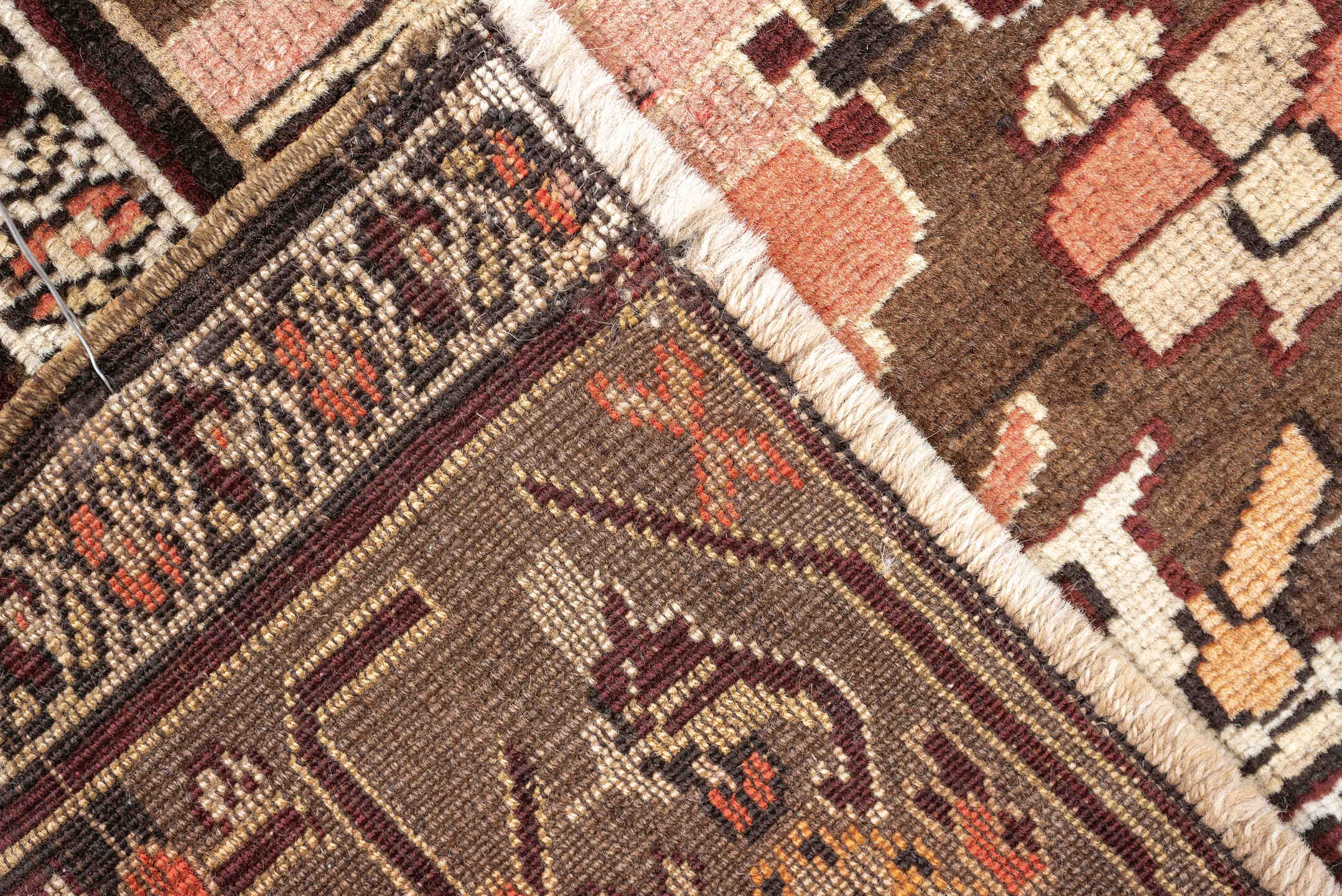 5' x 6' one-of-a-kind handmade antique Caucasian rug. Color palette: terracotta, ivory, taupe, brown, rose, mahogany, camel