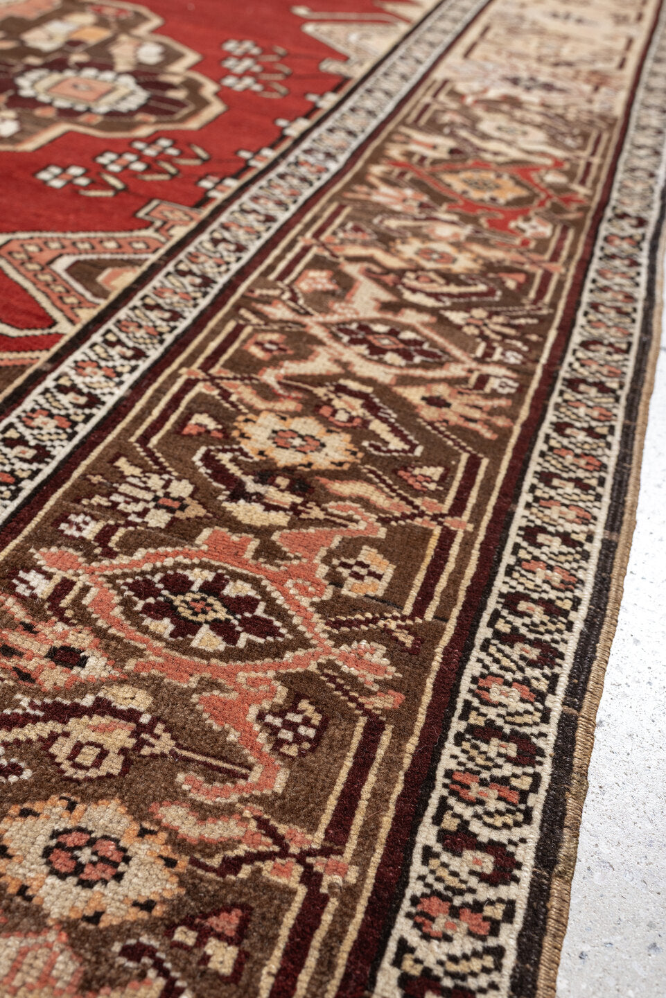 5' x 6' one-of-a-kind handmade antique Caucasian rug. Color palette: terracotta, ivory, taupe, brown, rose, mahogany, camel