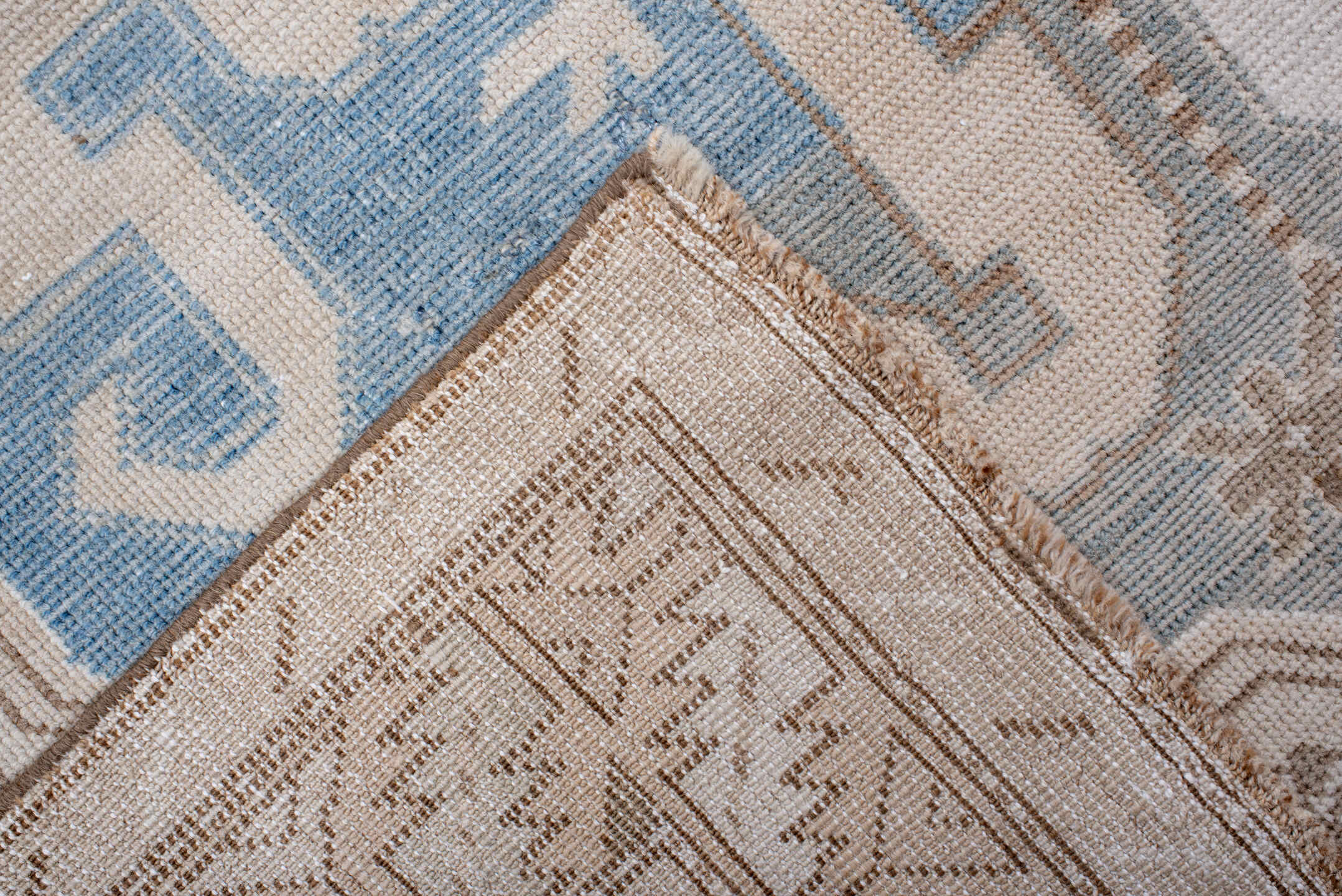 4' x 10' one-of-a-kind handmade vintage Caucasian runner rug. Color palette: ivory, sky blue, taupe, camel, beige