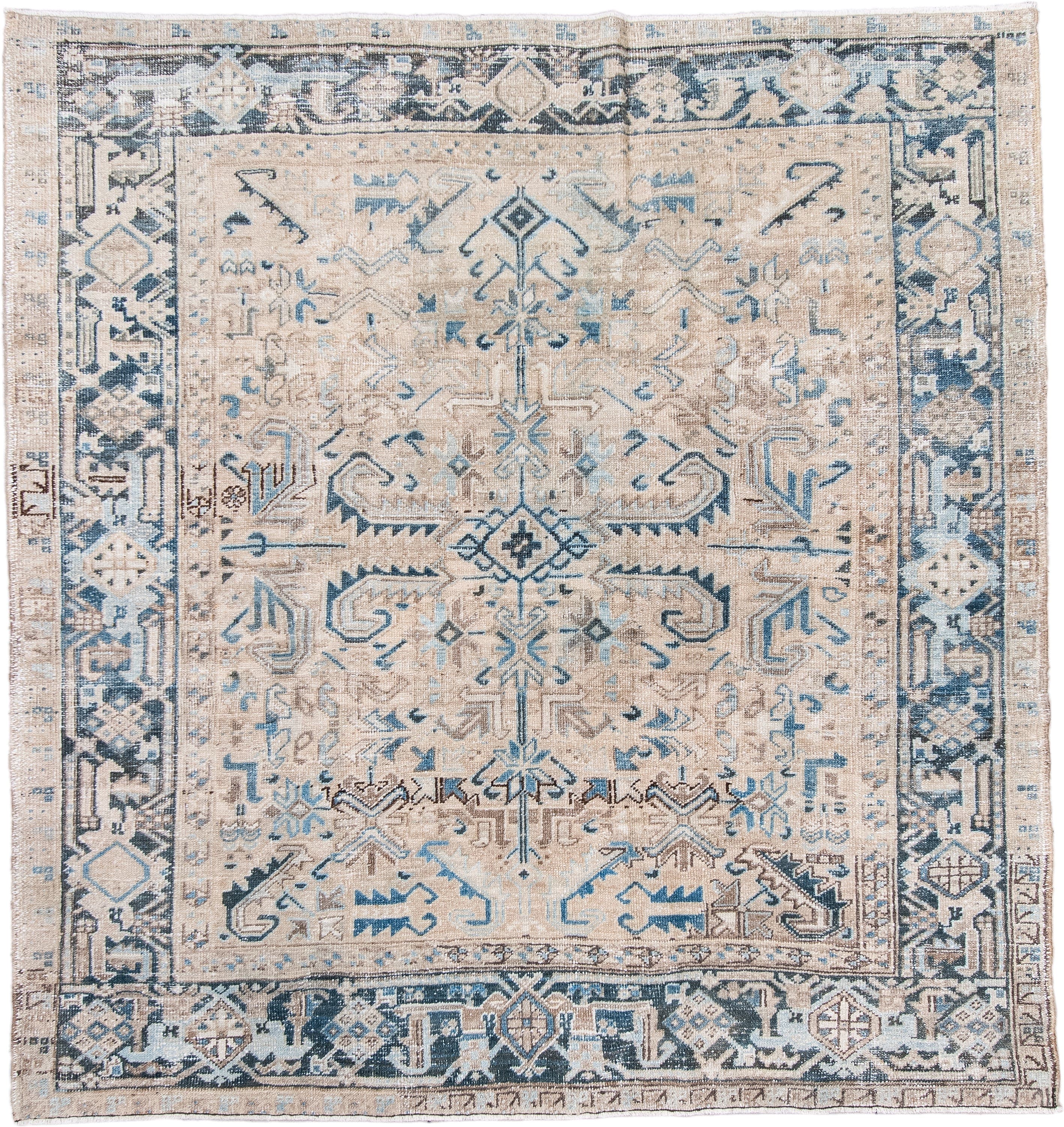 7' x 7' one-of-a-kind handmade antique Heriz rug. Color palette: ivory, beige, slate, taupe, sky blue, charcoal, gray