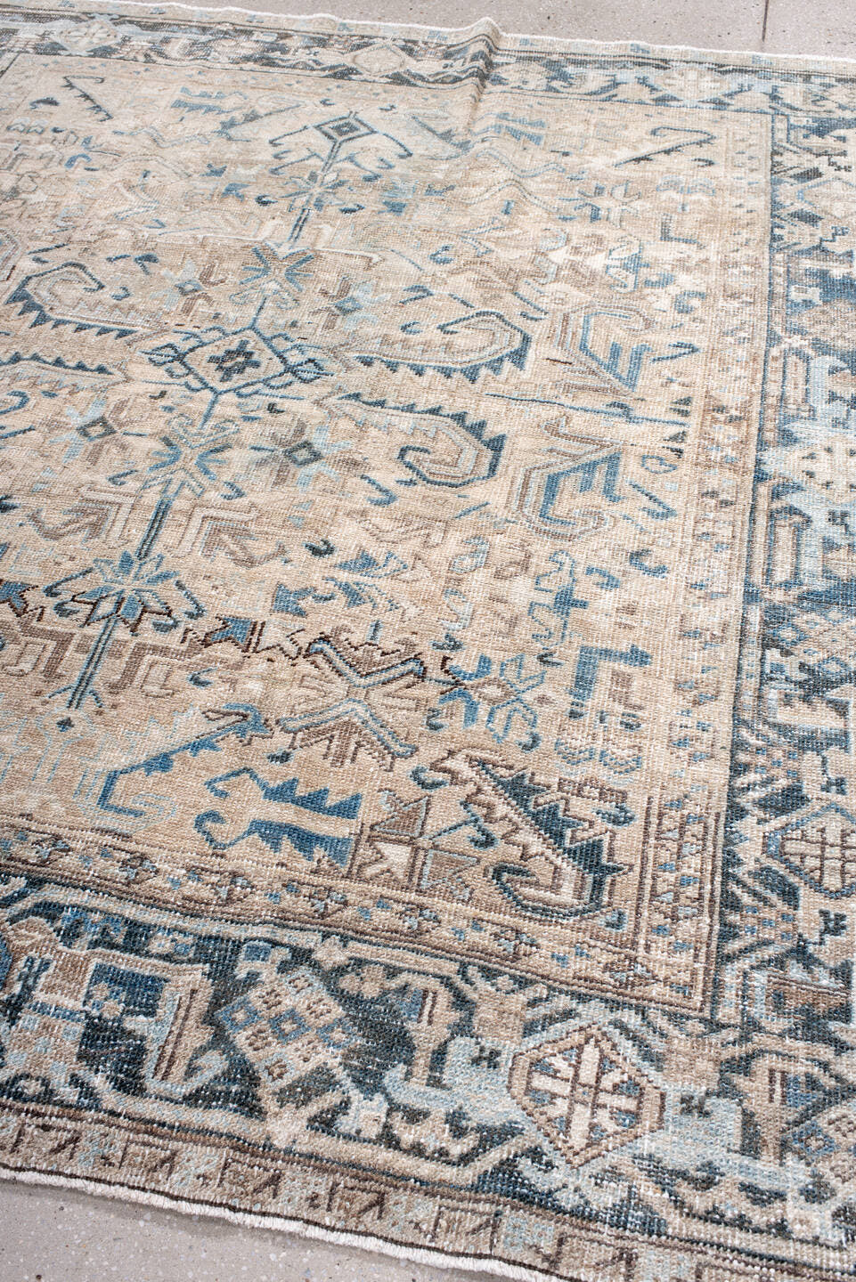 7' x 7' one-of-a-kind handmade antique Heriz rug. Color palette: ivory, beige, slate, taupe, sky blue, charcoal, gray