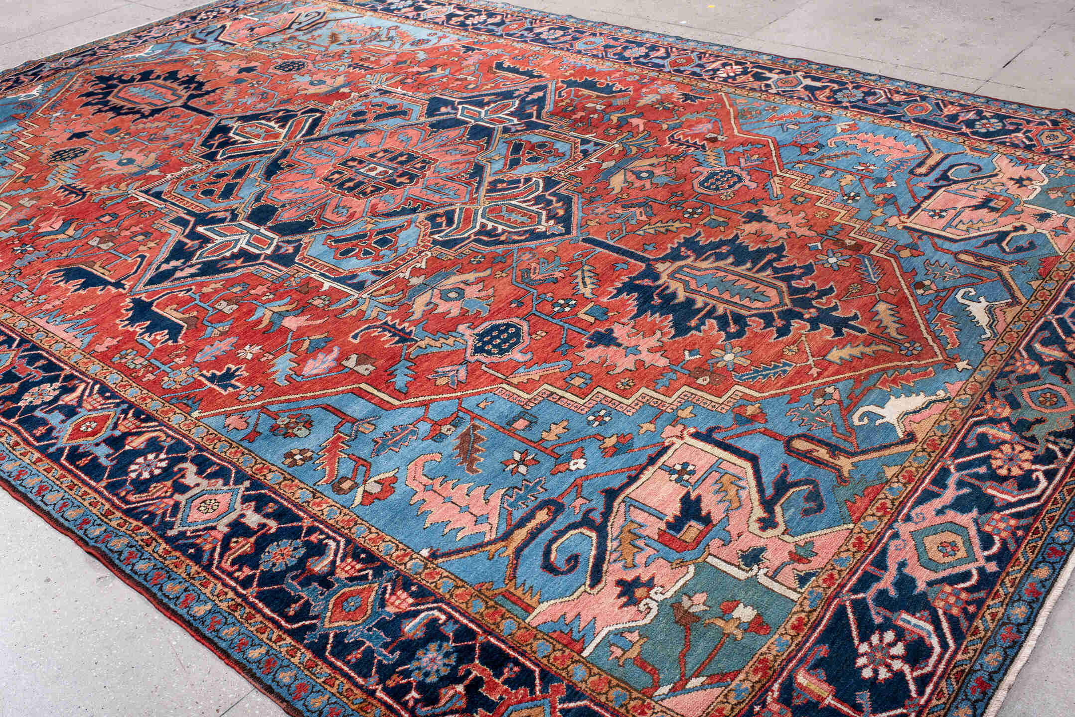 10' x 14' one-of-a-kind handmade antique Serapi large size rug. Color palette: rust, sky blue, navy, coral, ivory, slate