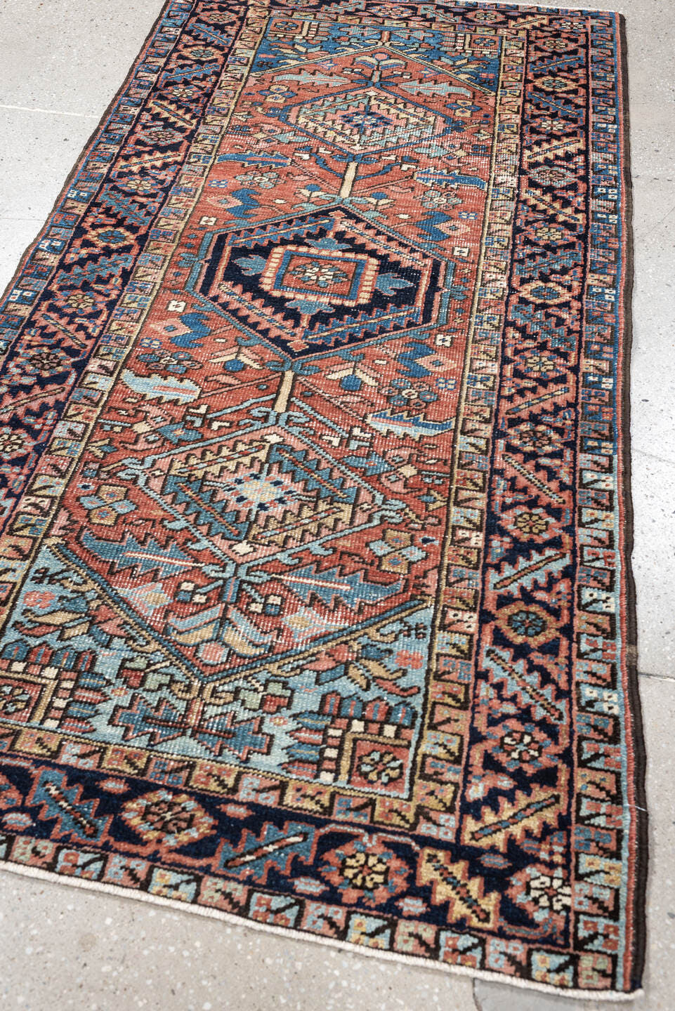 3' x 6' one-of-a-kind handmade antique Heriz small size rug. Color palette: terracotta, navy, sky blue, ivory, camel, rose