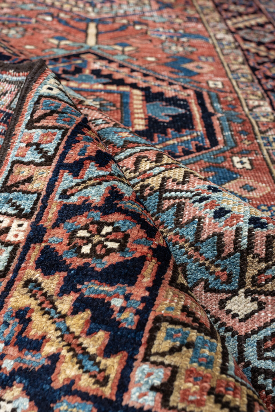 3' x 6' one-of-a-kind handmade antique Heriz small size rug. Color palette: terracotta, navy, sky blue, ivory, camel, rose