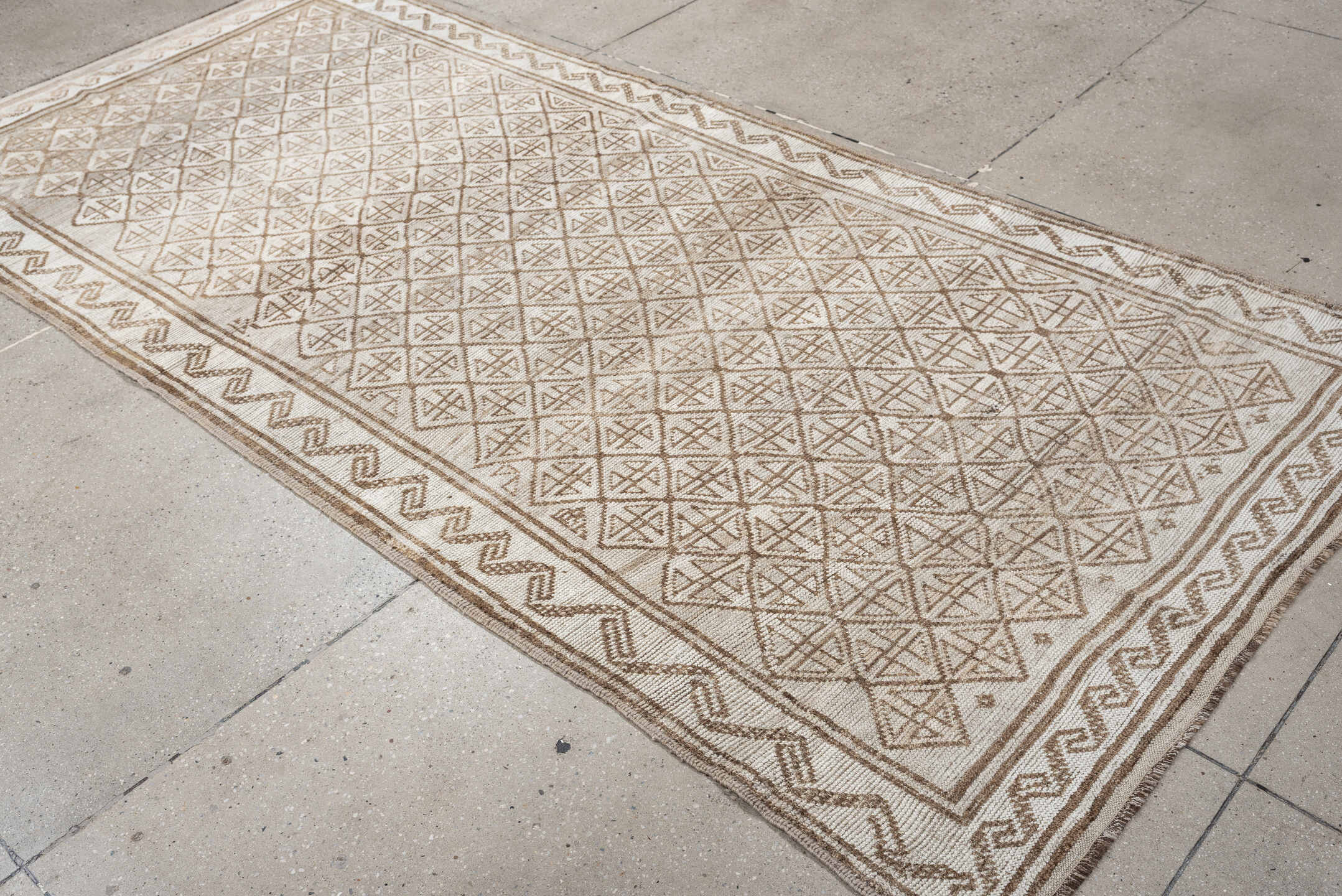 9' x 4' one-of-a-kind handmade antique Belouch rug. Color palette: ivory, camel, taupe, sand, light brown, beige, gray
