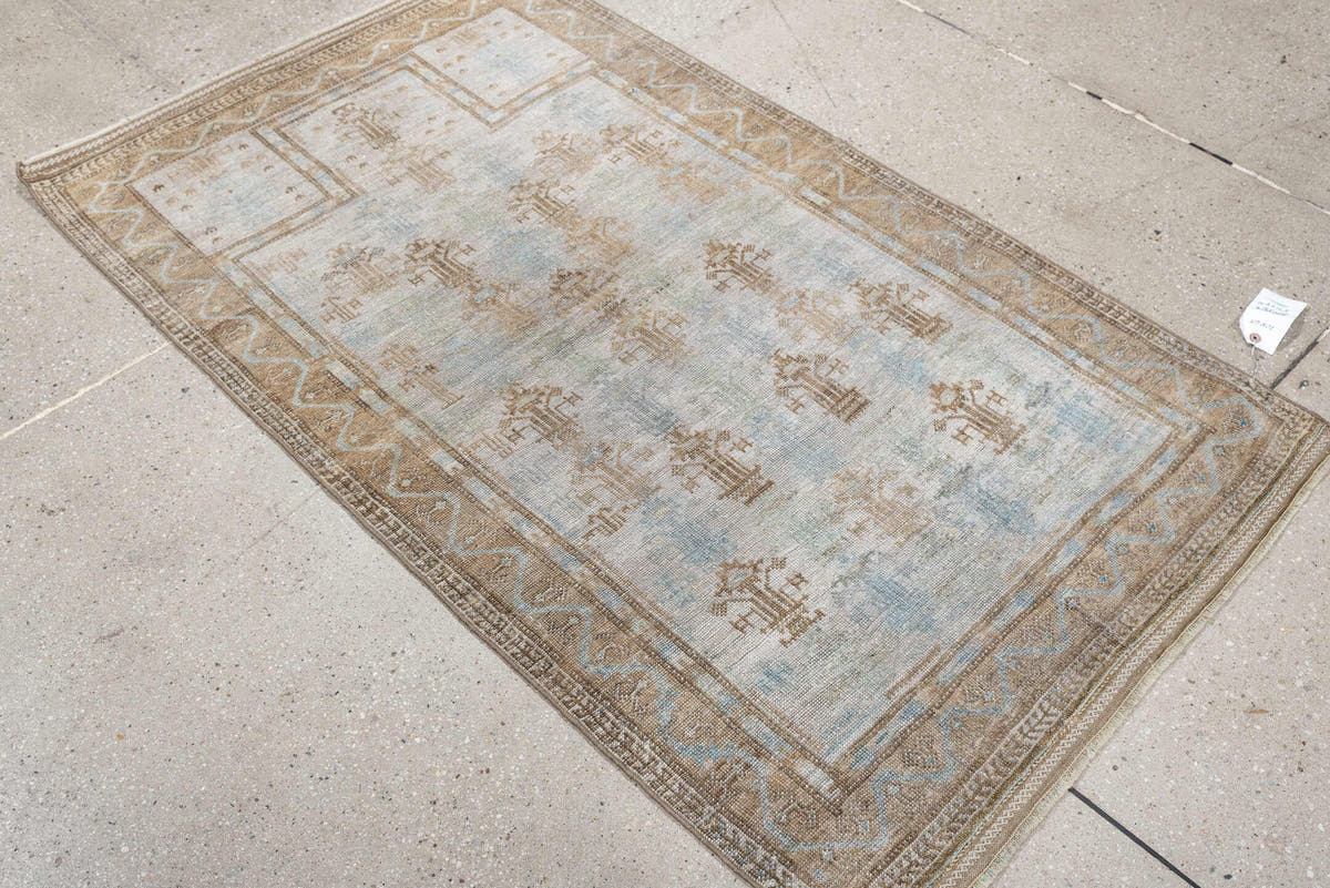 2' x 4' one-of-a-kind handmade antique Belouch small size rug. Color palette: ivory, camel, taupe, sky blue, beige