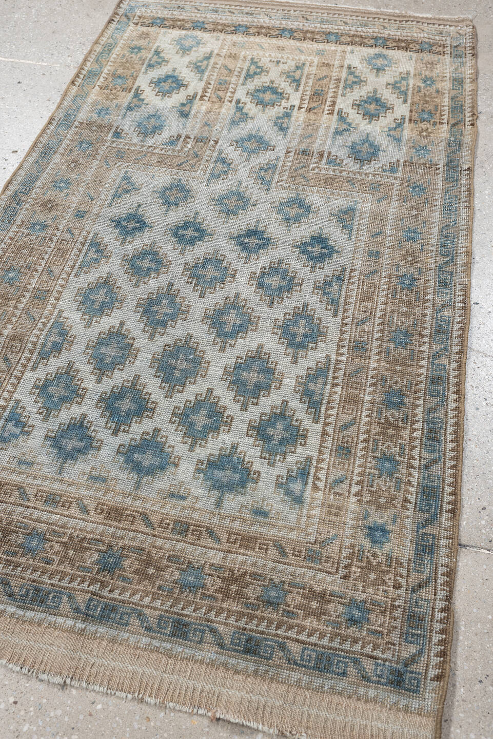 2' x 5' one-of-a-kind handmade antique Belouch small size rug. Color palette: ivory, sky blue, taupe, camel, beige