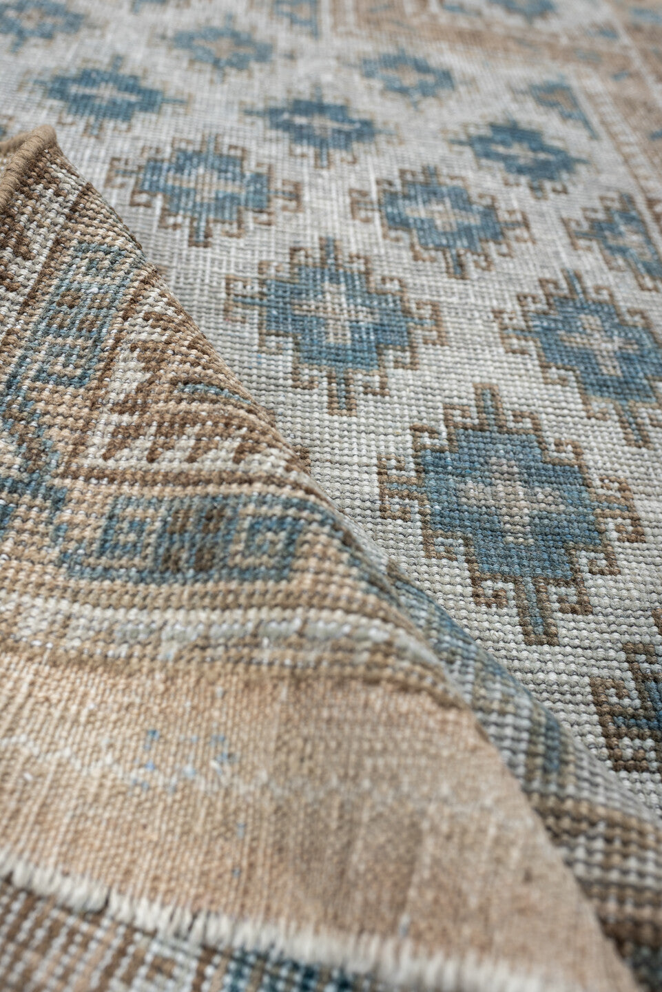 2' x 5' one-of-a-kind handmade antique Belouch small size rug. Color palette: ivory, sky blue, taupe, camel, beige